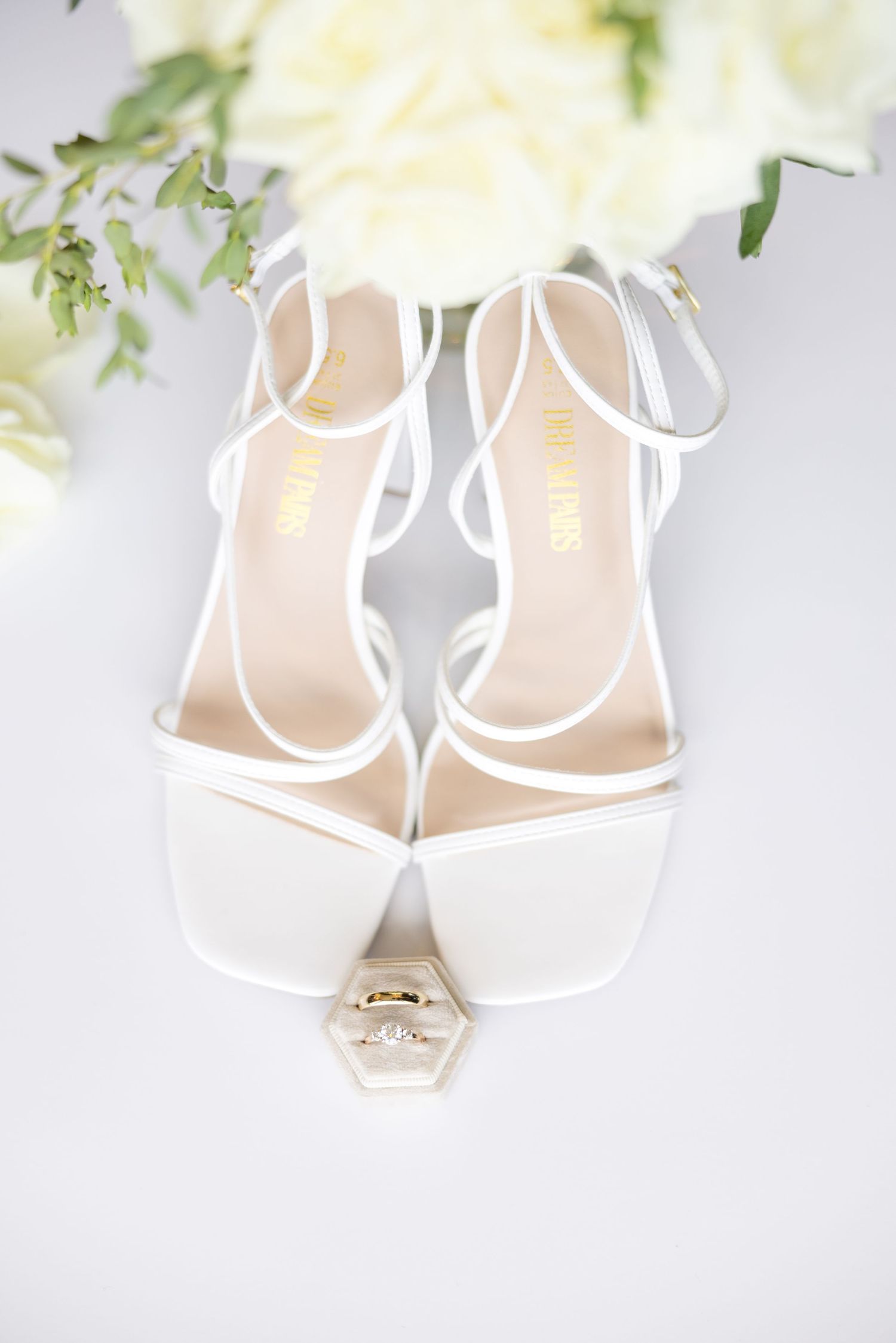 Getting ready photos at The Renaissance Hotel in downtown Toledo before a joyful Toledo Zoo wedding photographed by Julia & Sean Photography