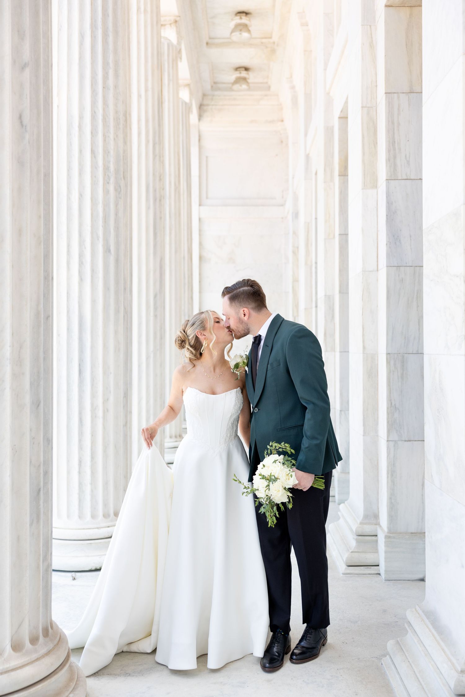 Bride and groom portraits at the Toledo Museum of Art before a Toledo Zoo wedding in Toledo, Ohio photographed by Julia & Sean Photography