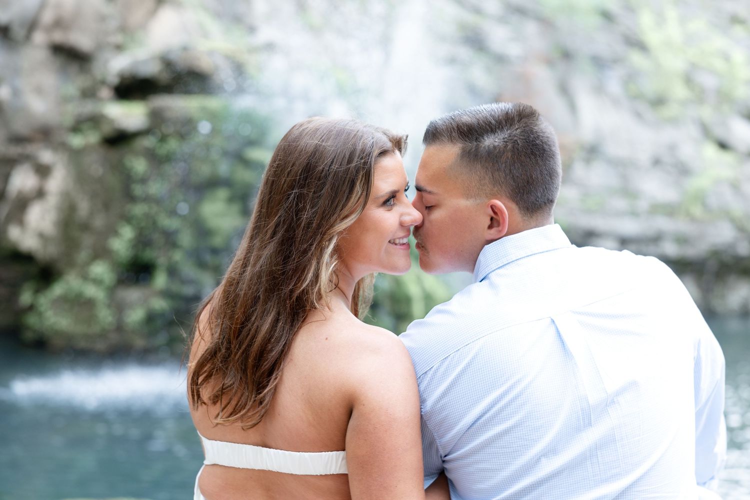 Downtown Huntsville engagement session at First National Bank and Big Spring Park by Julia and Sean Photography, capturing joyful moments.