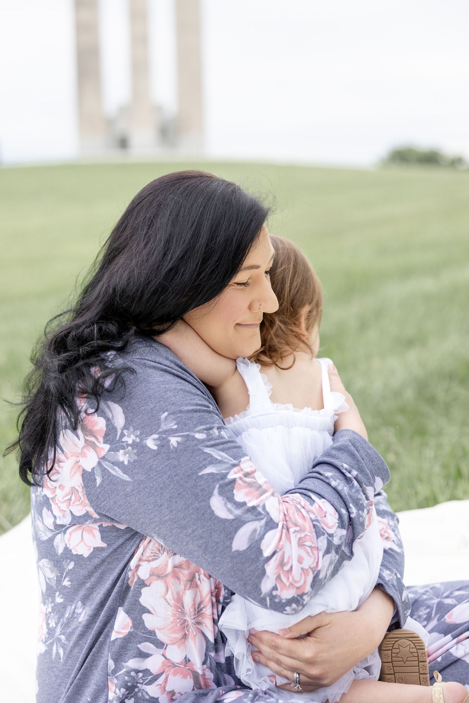 Joyful motherhood photos at Carillon Park in Dayton Ohio captured by Julia and Sean Photography during a soft spring day