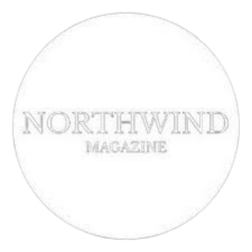 Faded circular logo design for Northwind Magazine with light gray text on white background.
