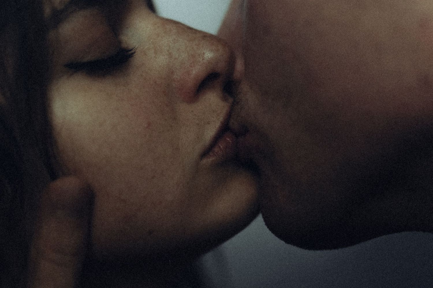 Intimate close-up photograph of a romantic moment in soft focus captured by a destination couples photographer.