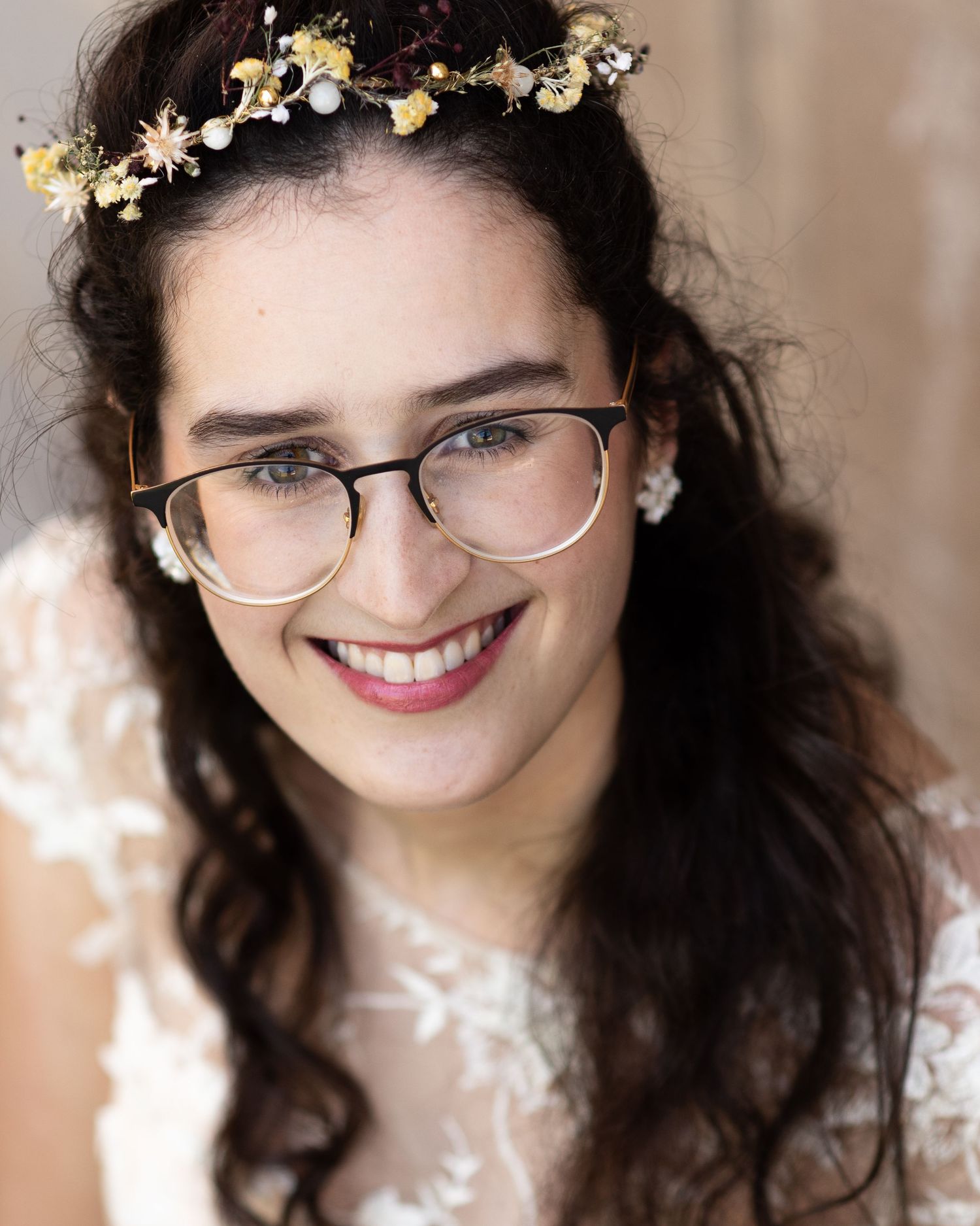 Portrait series with delicate flower crown decorations and glasses against a light background.