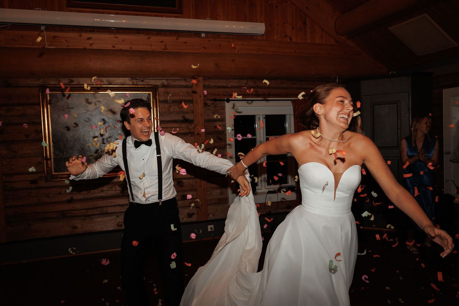 Collage of candid reception moments with couples laughing and dancing at a rustic barn wedding celebration.