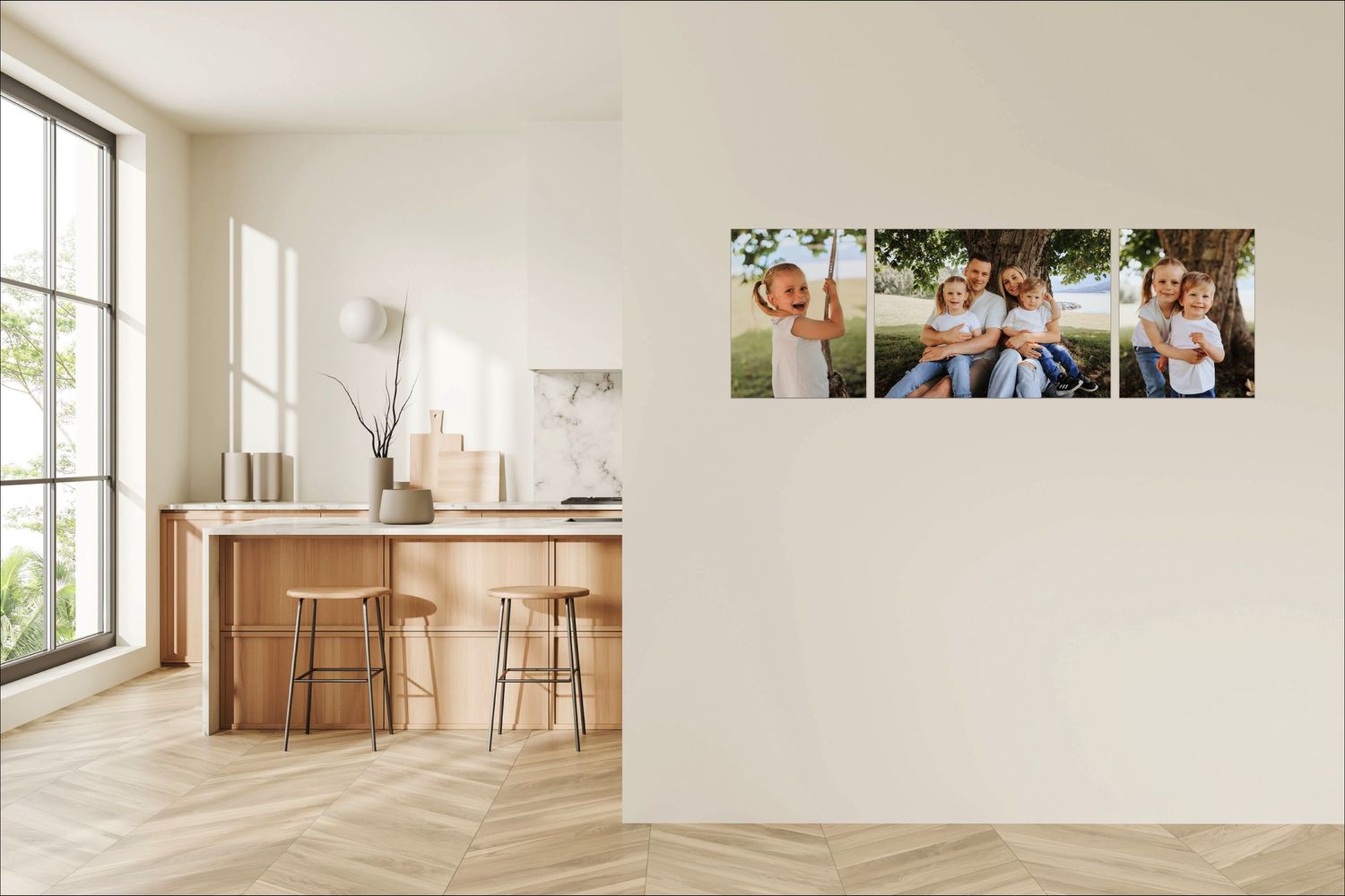 Modern minimalist kitchen interior with wooden bar table and photo canvas prints displayed on cream colored wall.