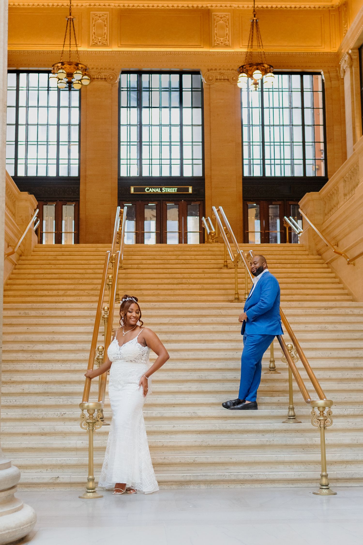 Wedding couple in formal attire pose for romantic first look sequence on grand marble staircase.