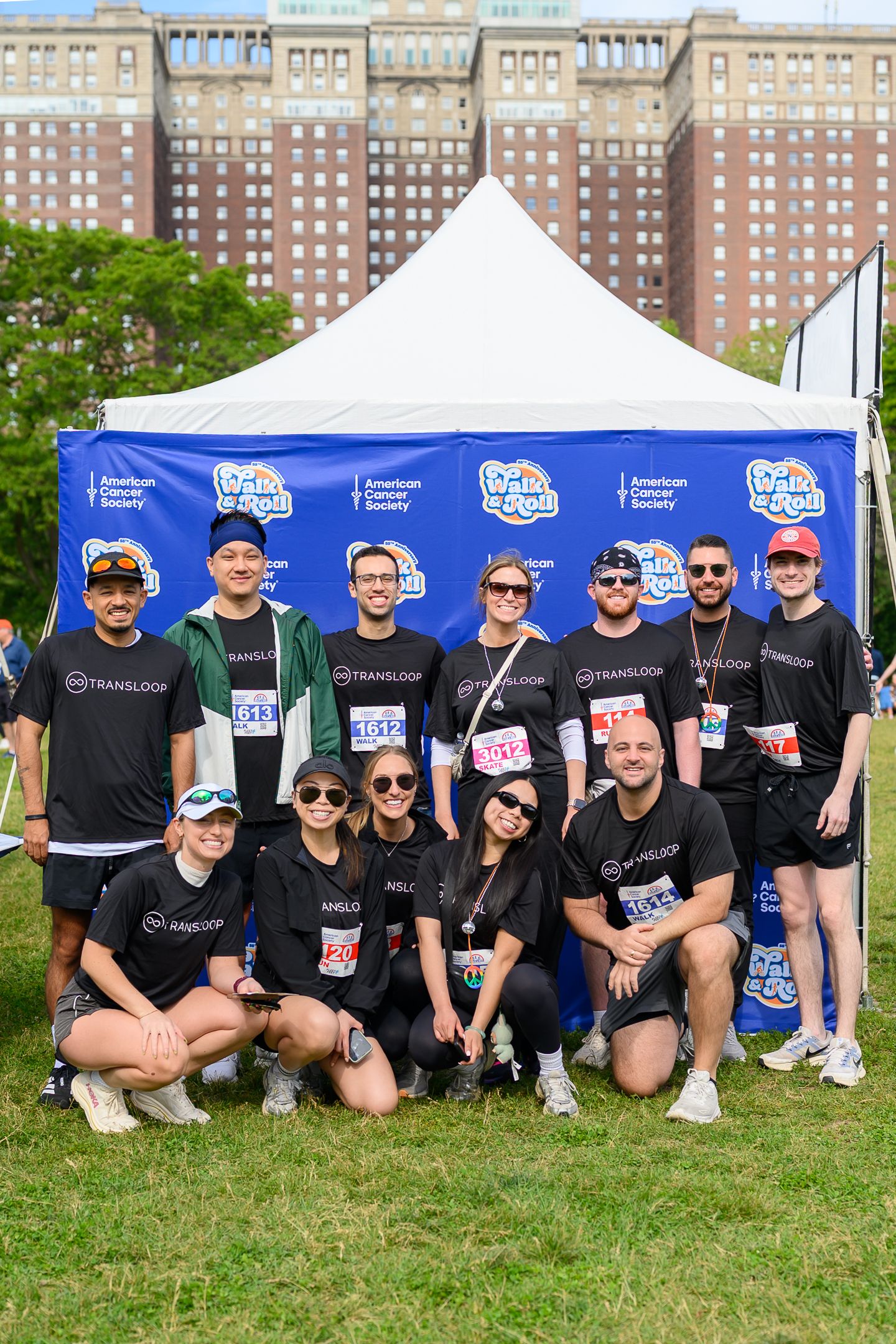 Team Transloop poses together at the American Cancer Society Walk & Roll Chicago event in matching black shirts.