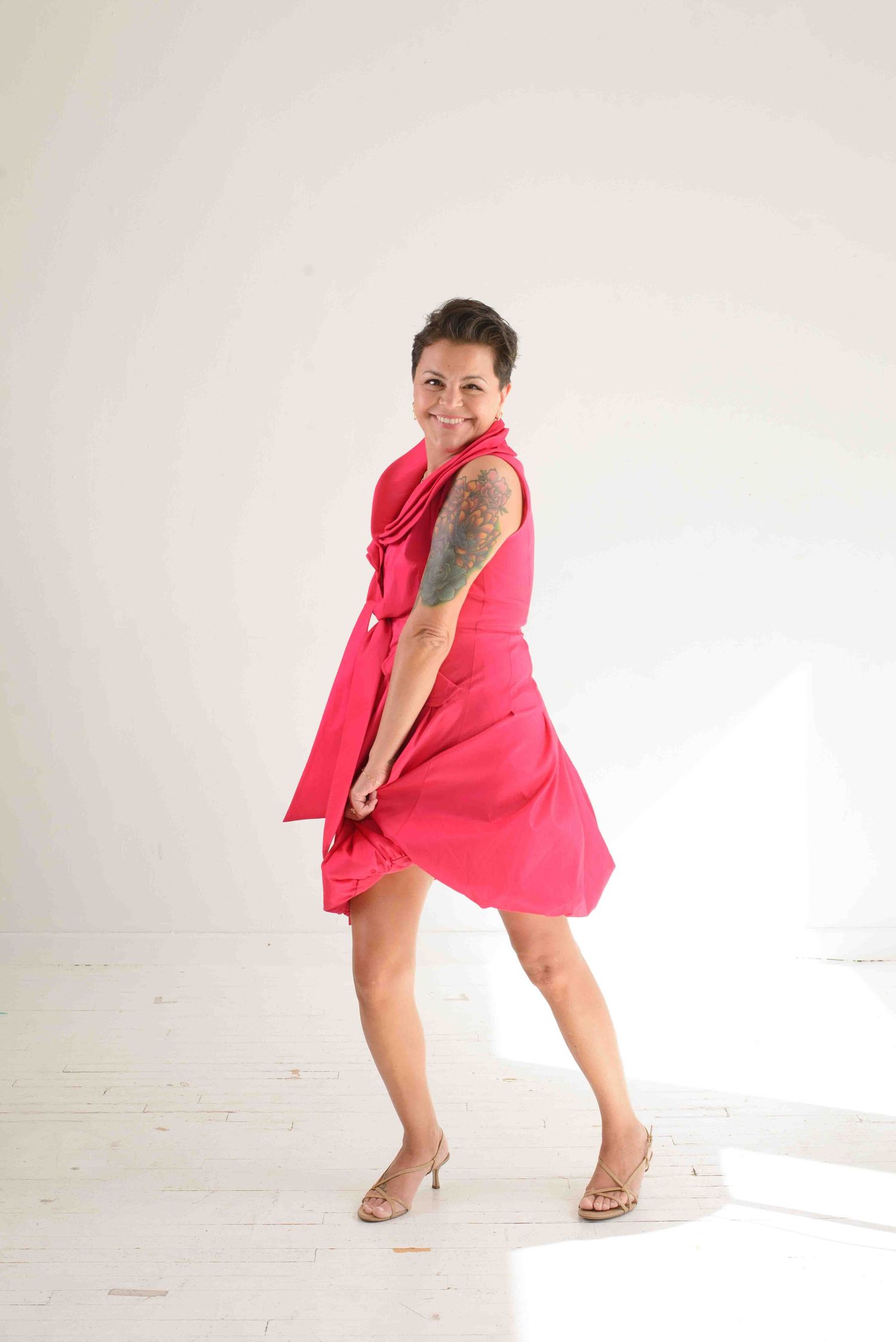 Dynamic poses in pink dress against white studio background.