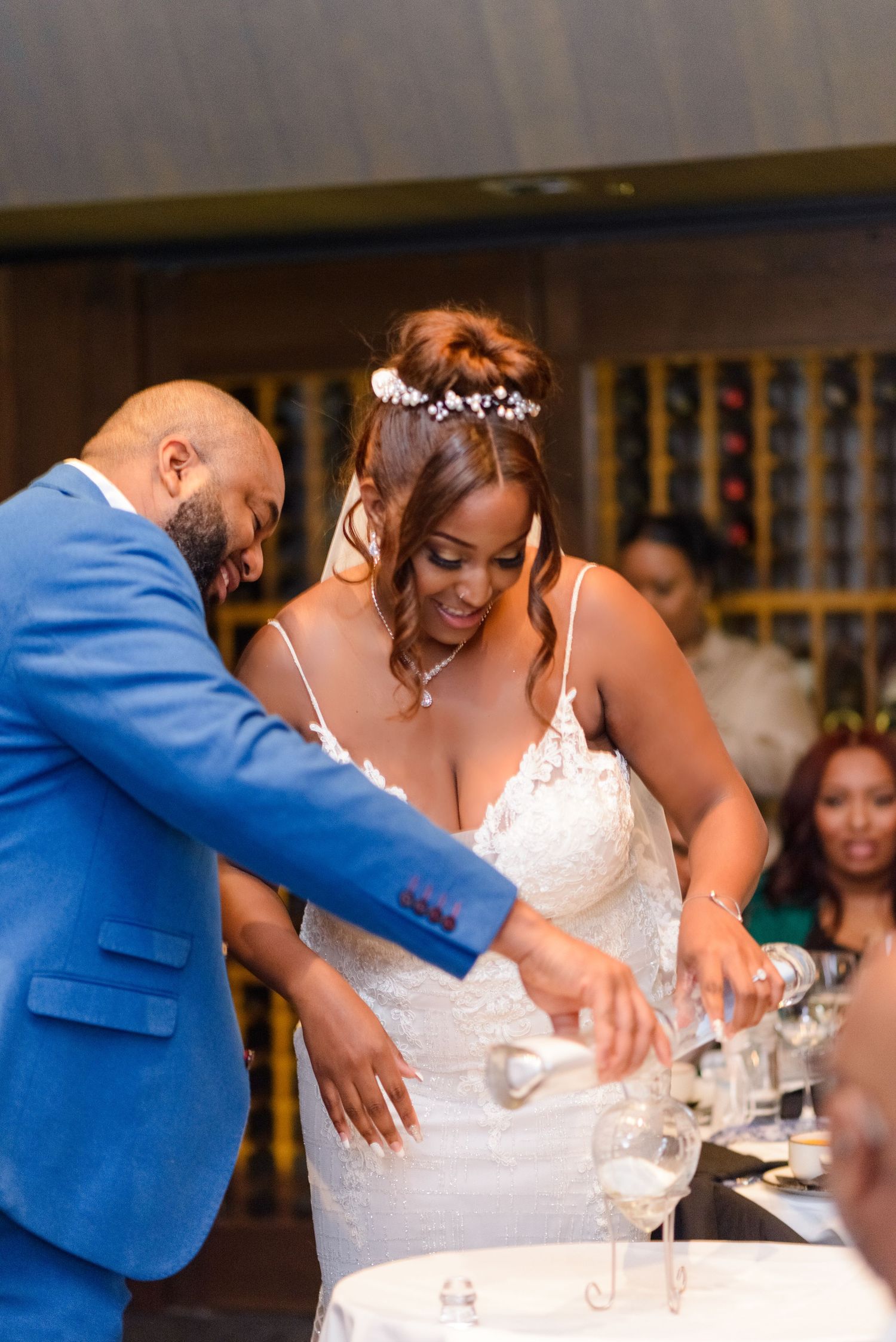 Wedding couple shares a joyful moment during their cake cutting ceremony.