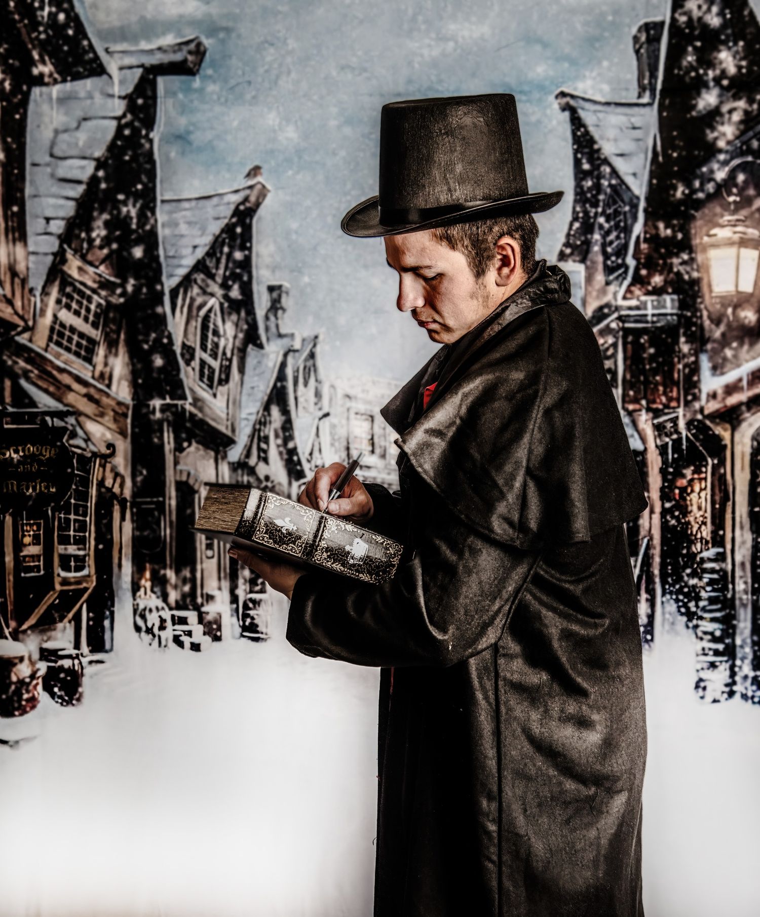 A figure in Victorian attire reads a book on a snowy cobblestone street with historic buildings and lanterns.