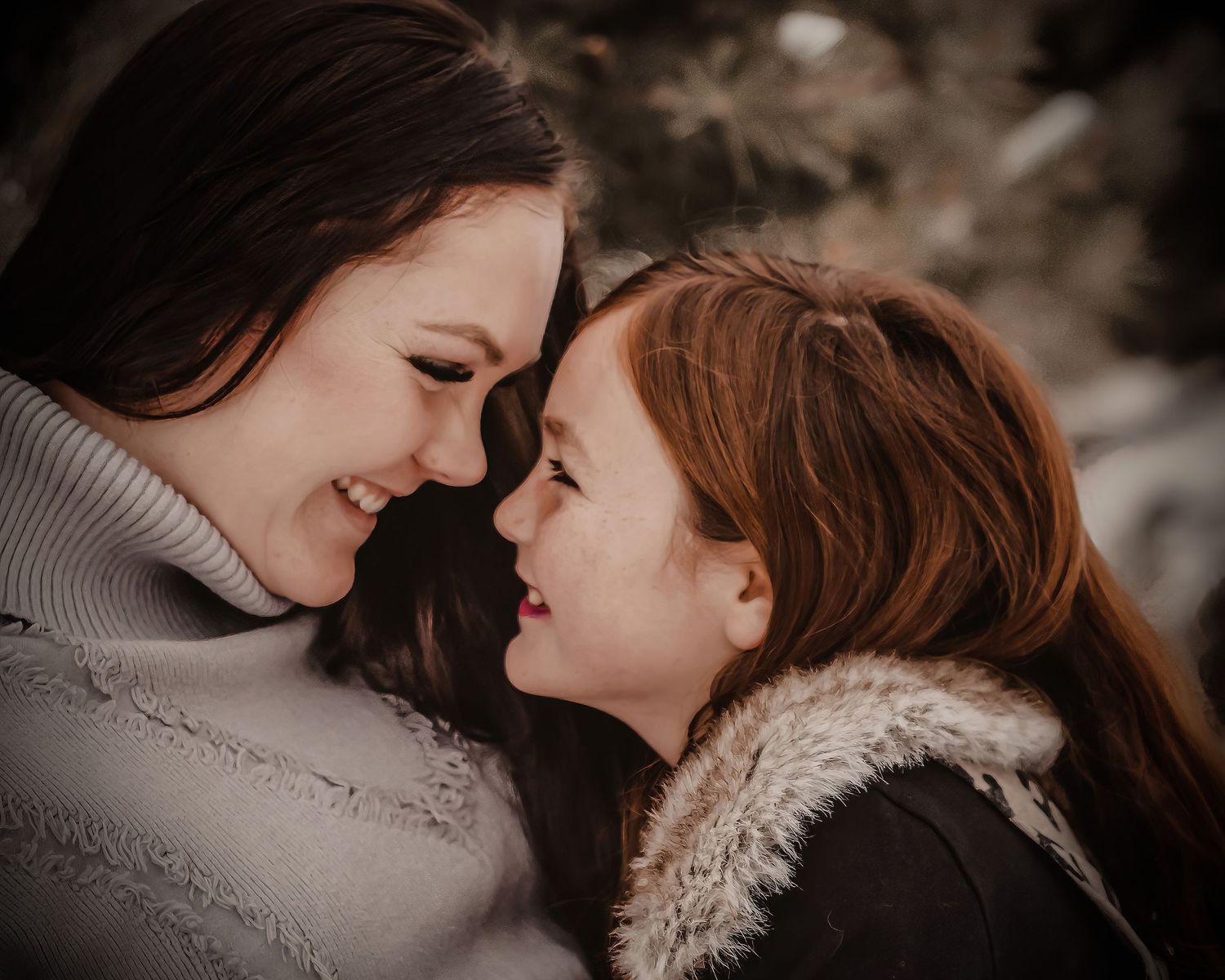 An intimate moment shared between two people in warm sweaters against a moody sepia background.