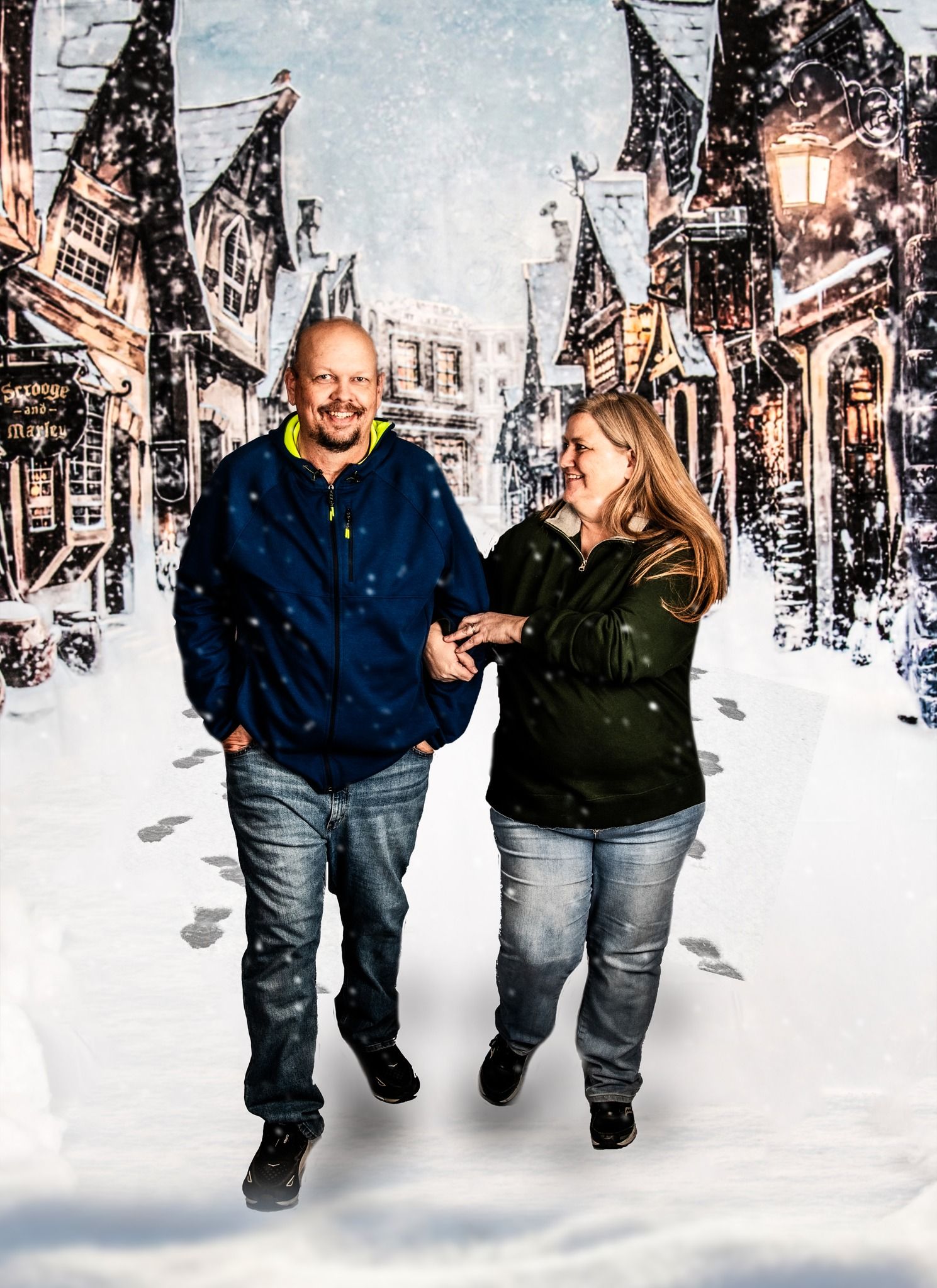 A couple walking hand in hand through a snowy winter scene with glowing street lamps creating a romantic atmosphere.