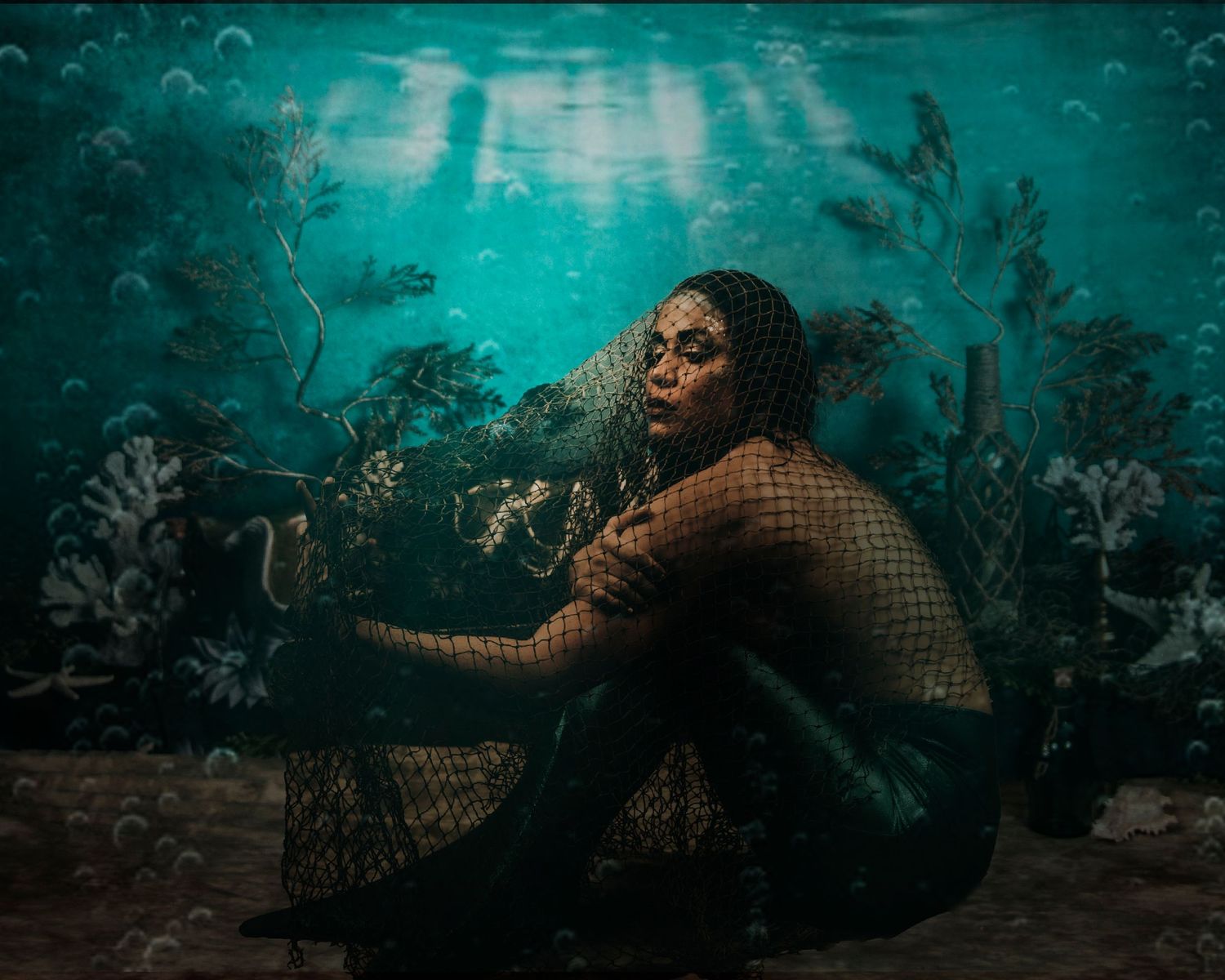 Underwater fantasy scene with ethereal lighting and coral formations in turquoise tones.