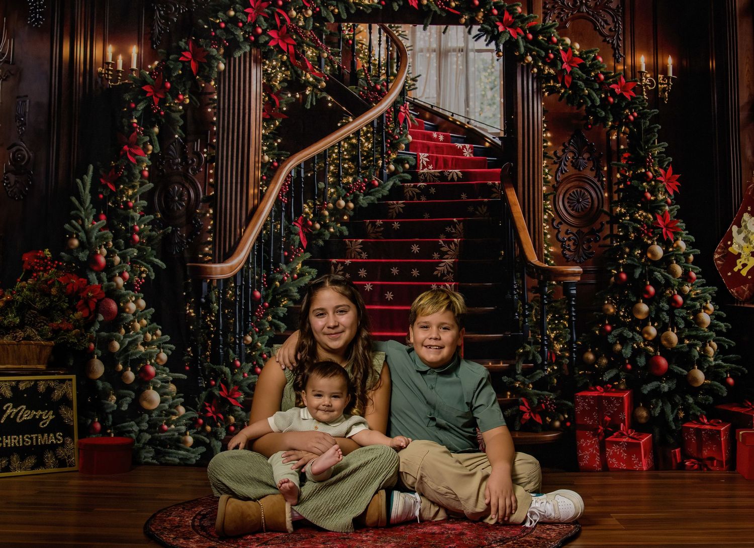Festive Christmas scene with red roses and decorations around an elegant staircase with people sitting together.