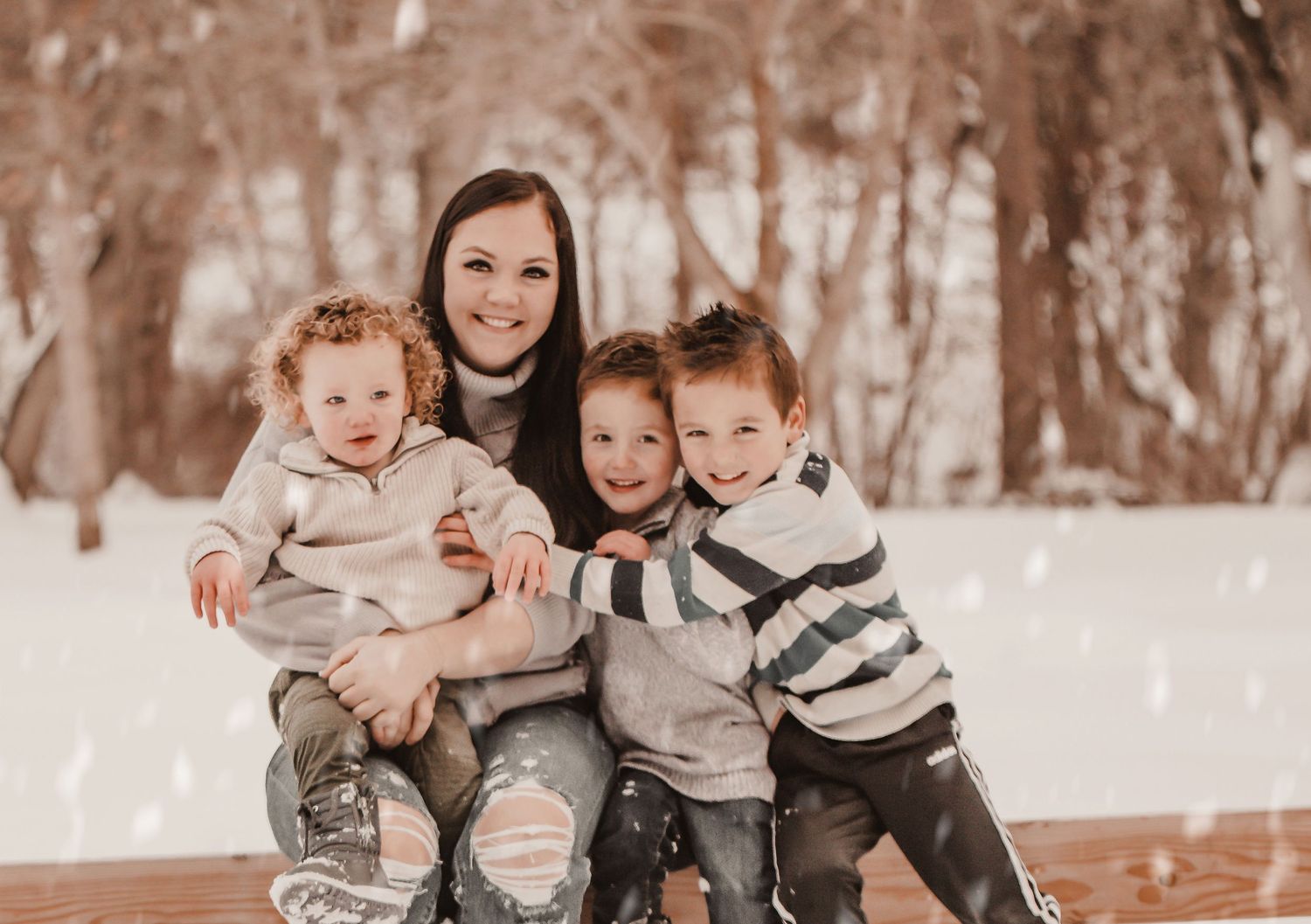 Winter portrait in snowy scene with children in warm clothing.