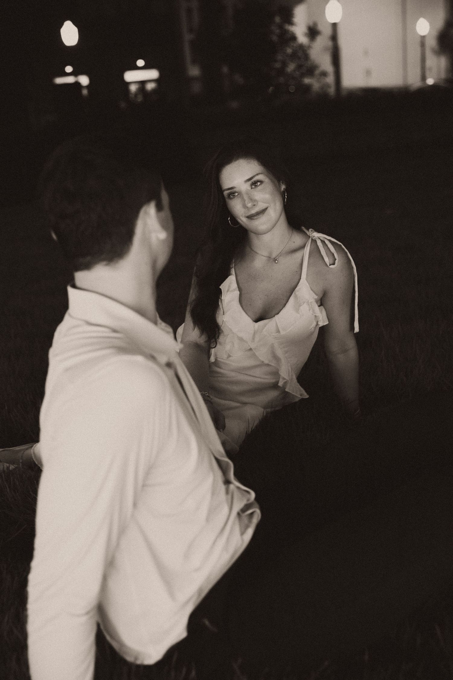Couple celebrating a surprise proposal in Downtown Mobile, Alabama