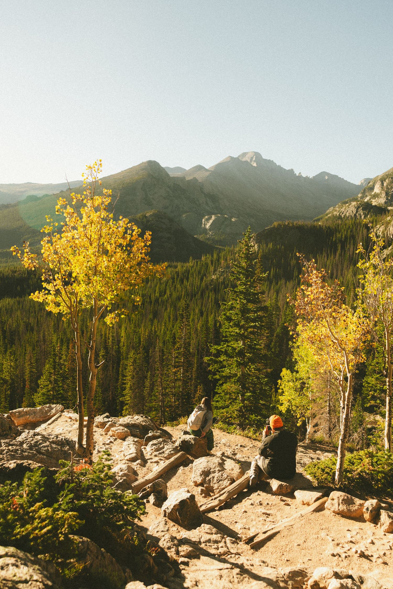 Adventurous couple exploring the Rocky Mountains during a cinematic couples photography session