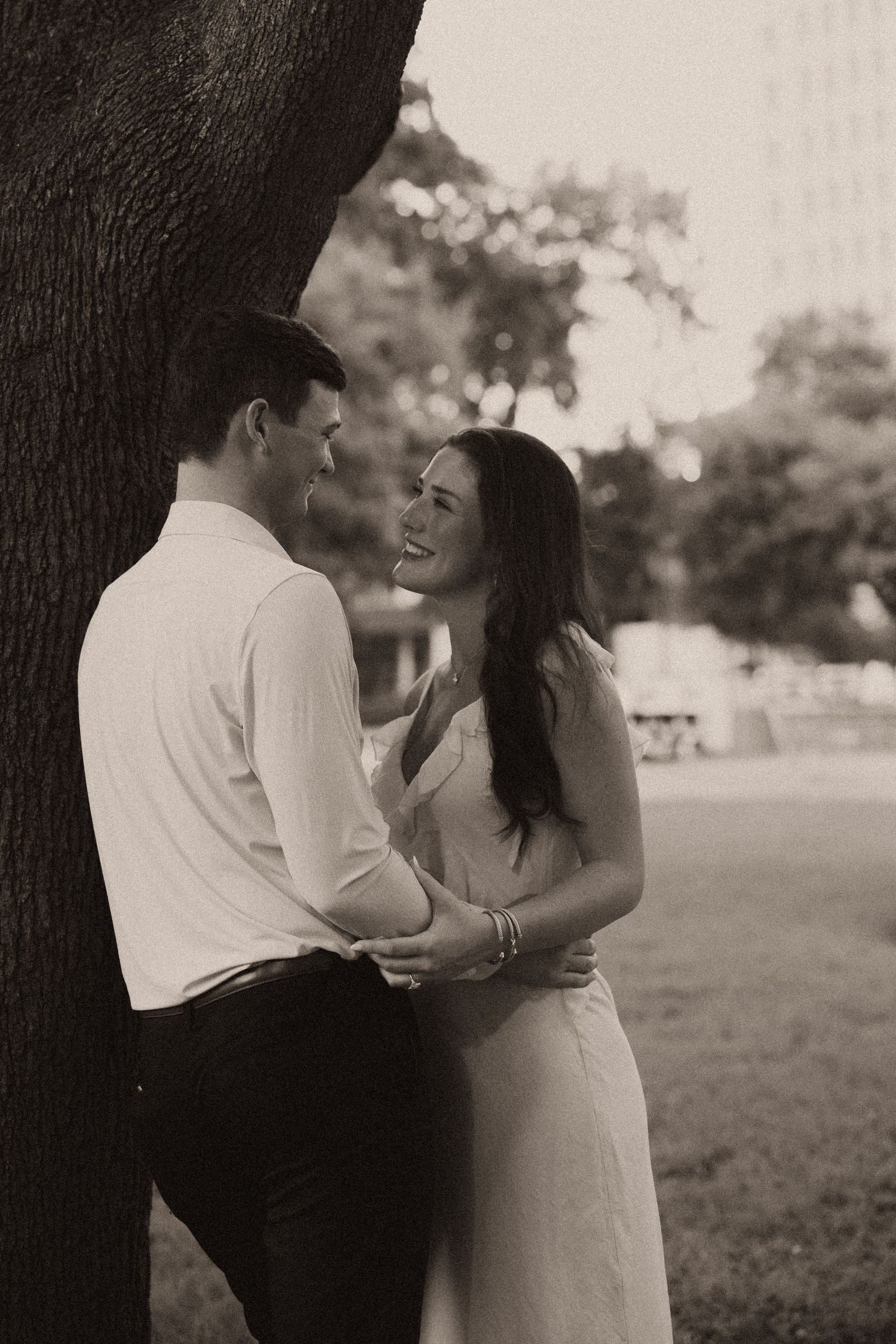 Couple celebrating a surprise proposal in Downtown Mobile, Alabama