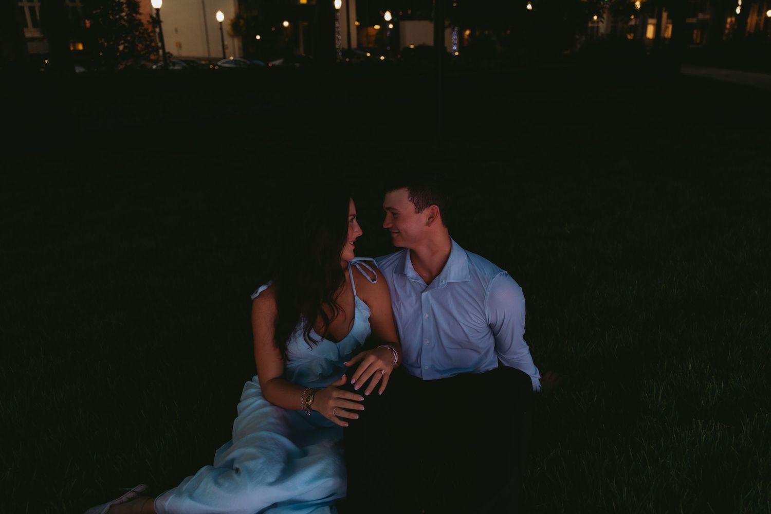 Couple celebrating a surprise proposal in Downtown Mobile, Alabama