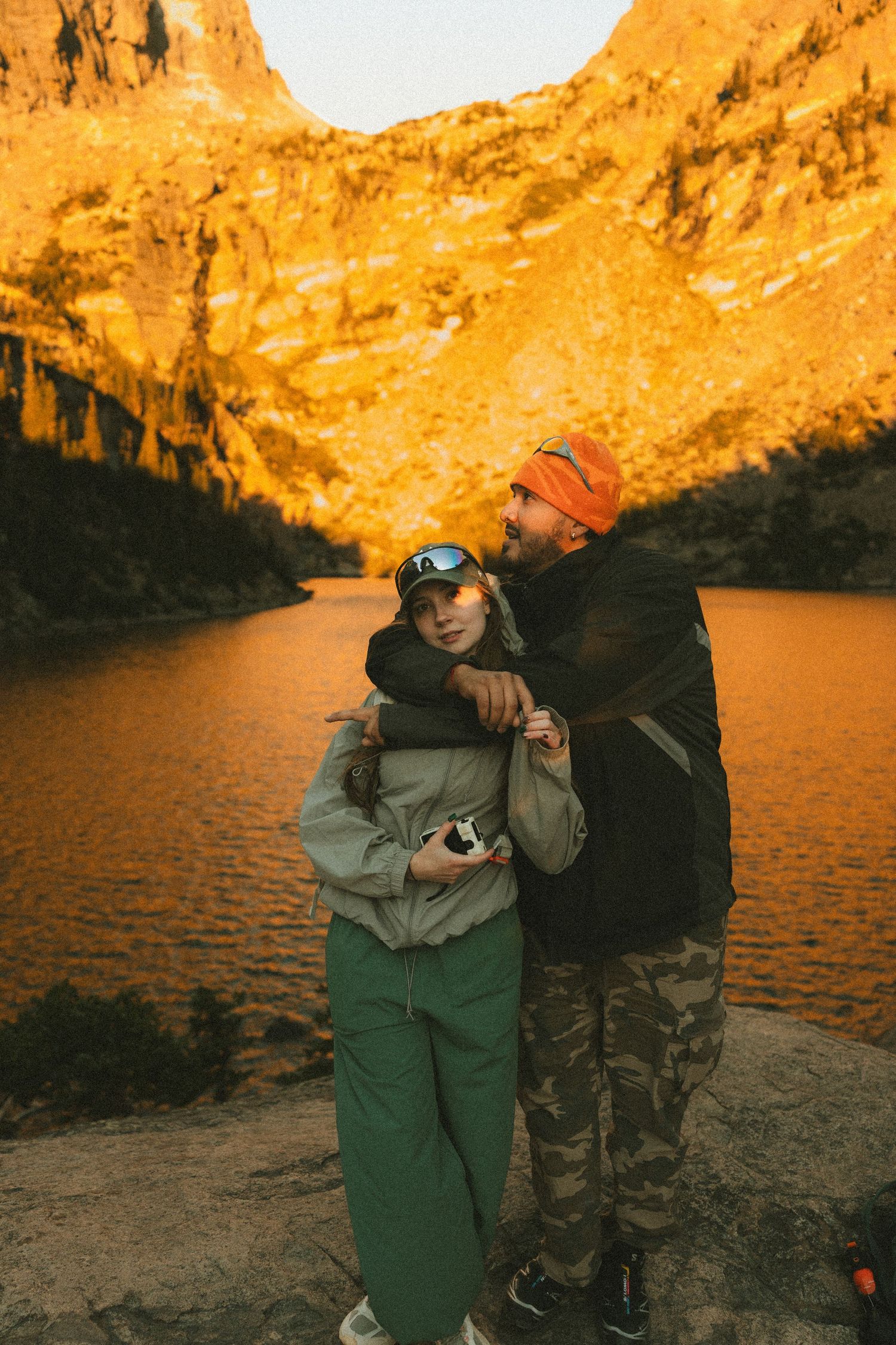 Adventurous couple exploring the Rocky Mountains during a cinematic couples photography session