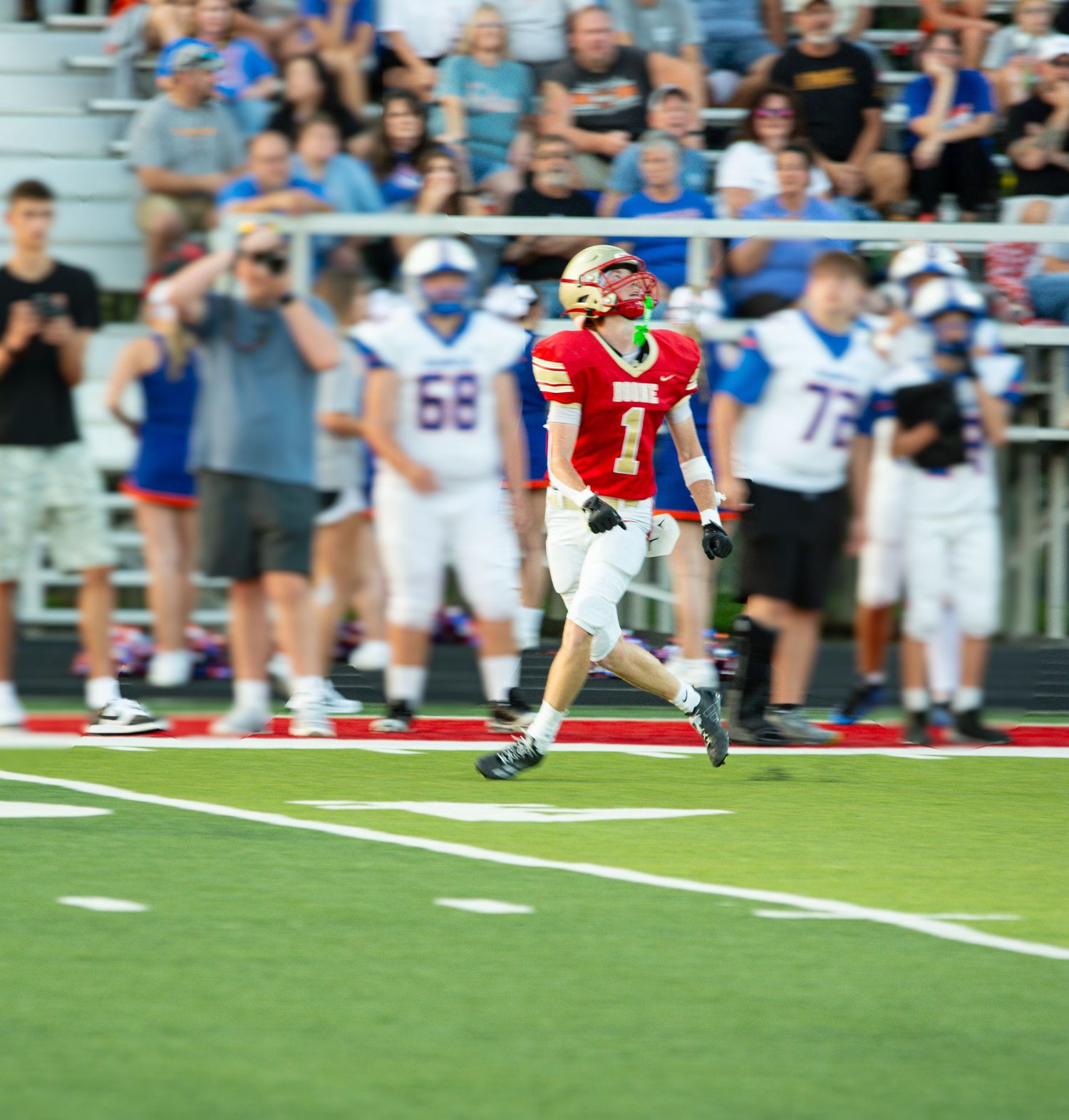 Daniel Boone High School football player running onto the field before a game in Gray, Tennessee.