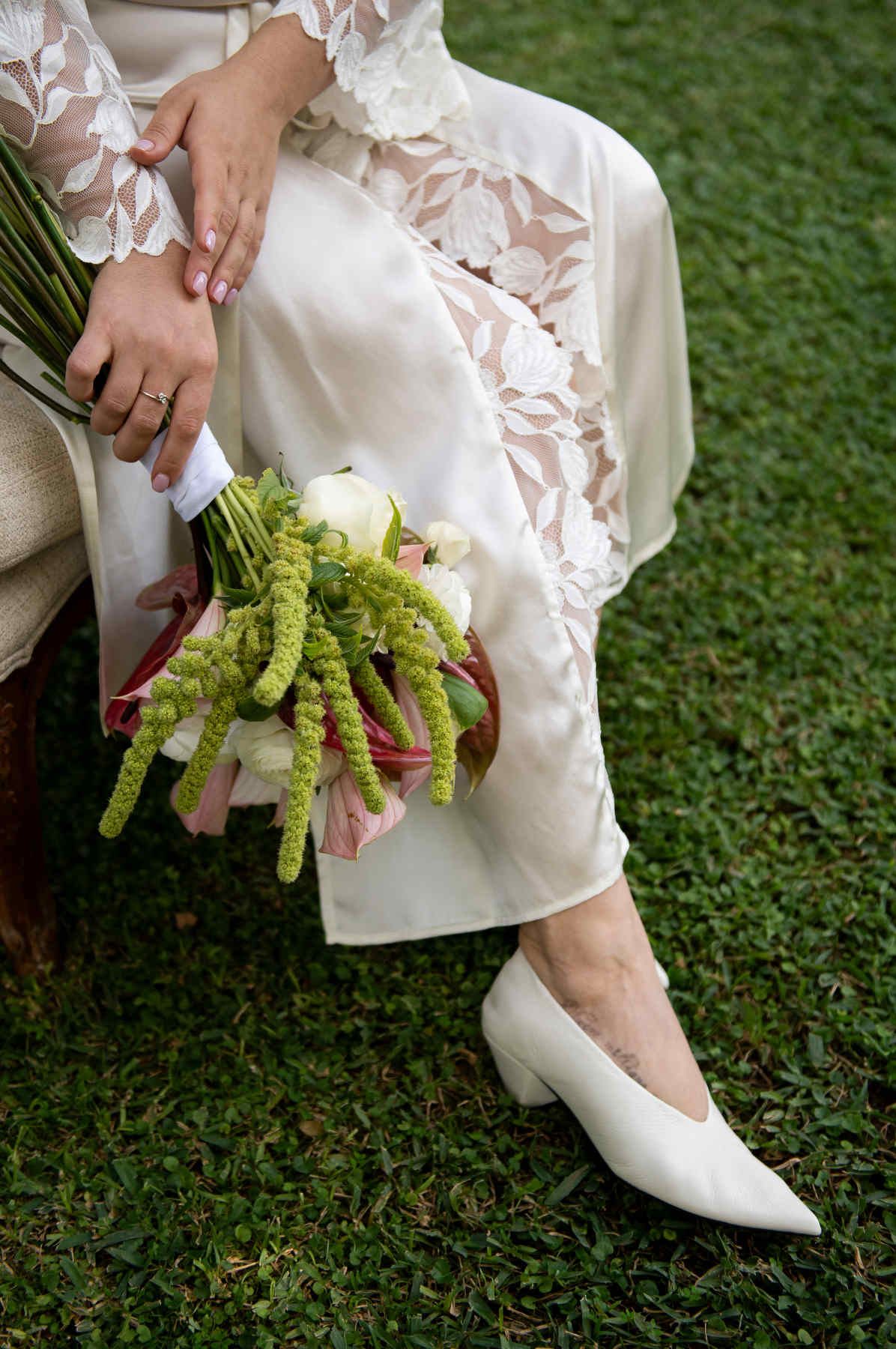 Bridal morning details featuring an artistic wedding bouquet and designer shoes at Casa Santonja