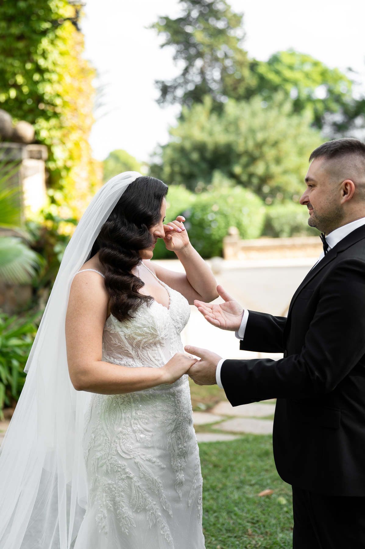 Bride wiping away happy tears as she meets the groom for their first look at Casa Santonja.