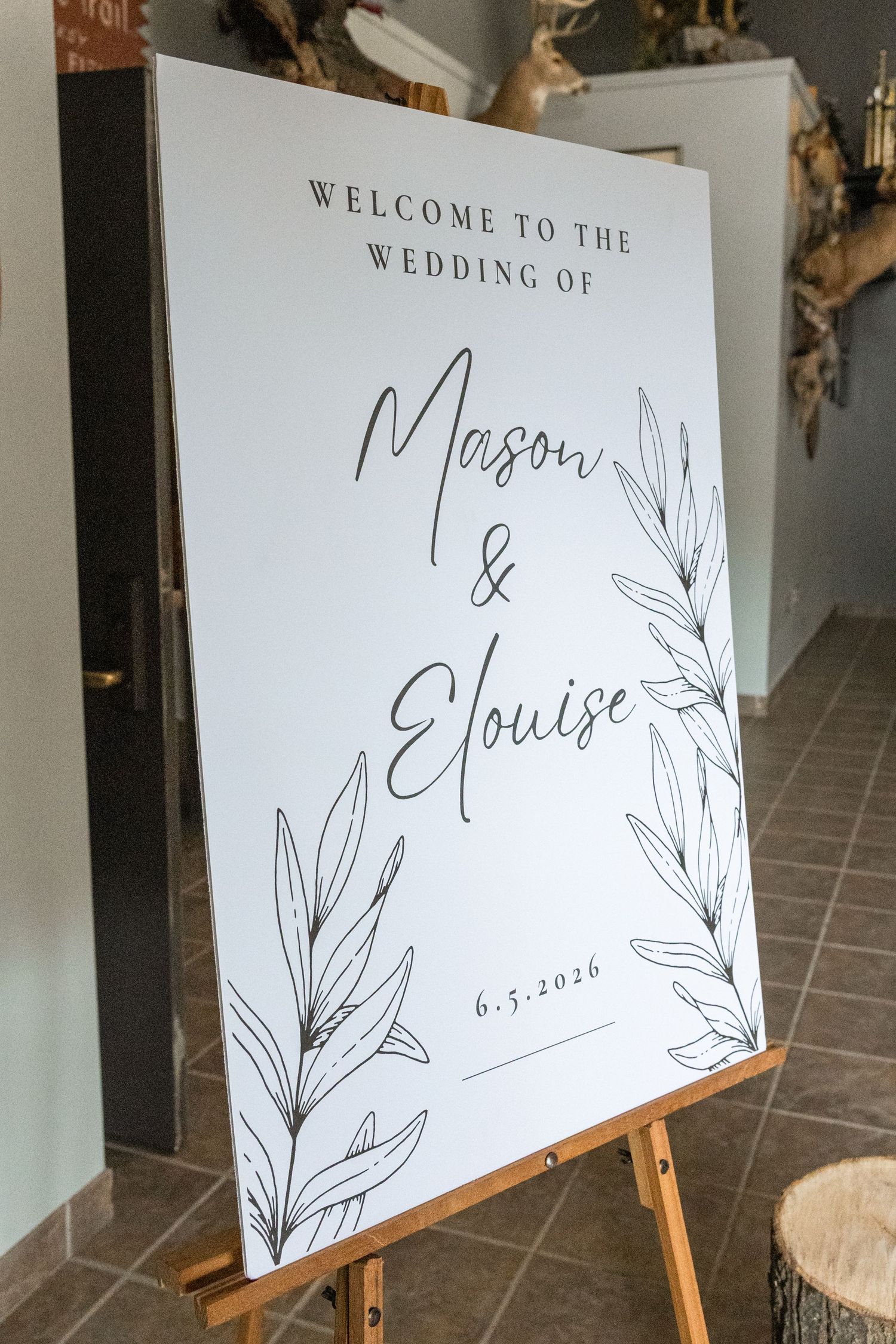 Elegant wedding welcome sign for Mason and Elouise on June 5, 2026, with botanical illustrations.