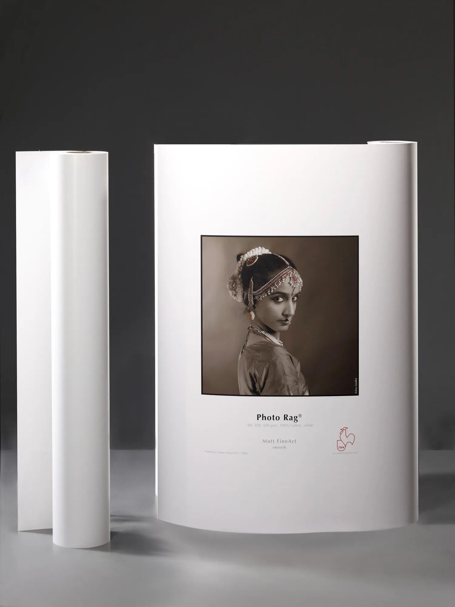 Hahnemuhle Photo Rag fine art inkjet paper rolls and sheet with elegant black and white portrait print.