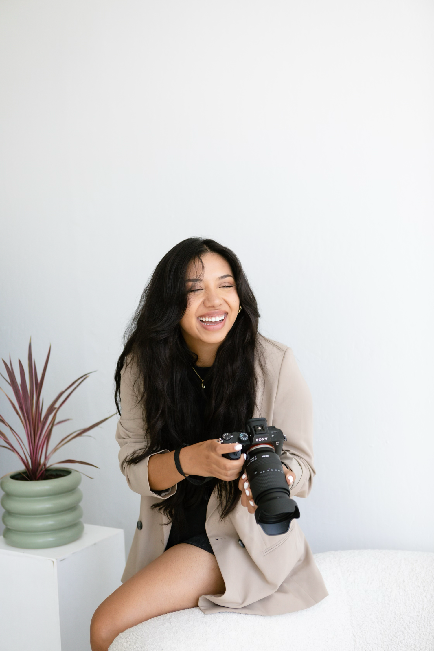 Creative professional Karen Howeth holding a camera during a photography production