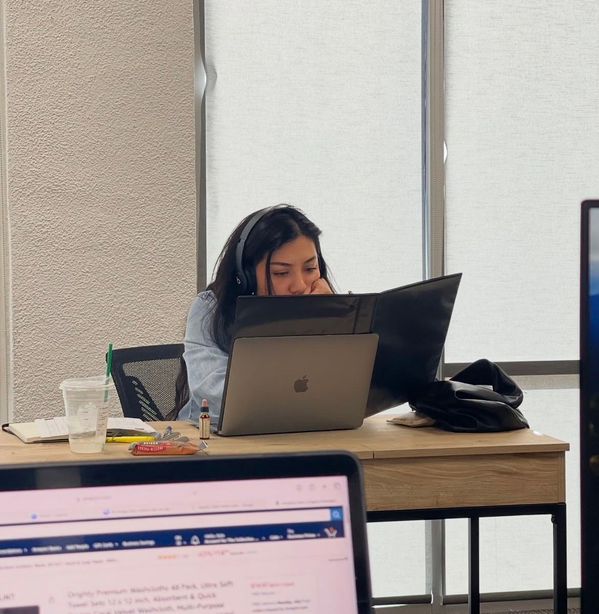 Creative professional Karen Howeth working on the design and promotional campaign for 10 Things They Didn't Tell Me About Leadership