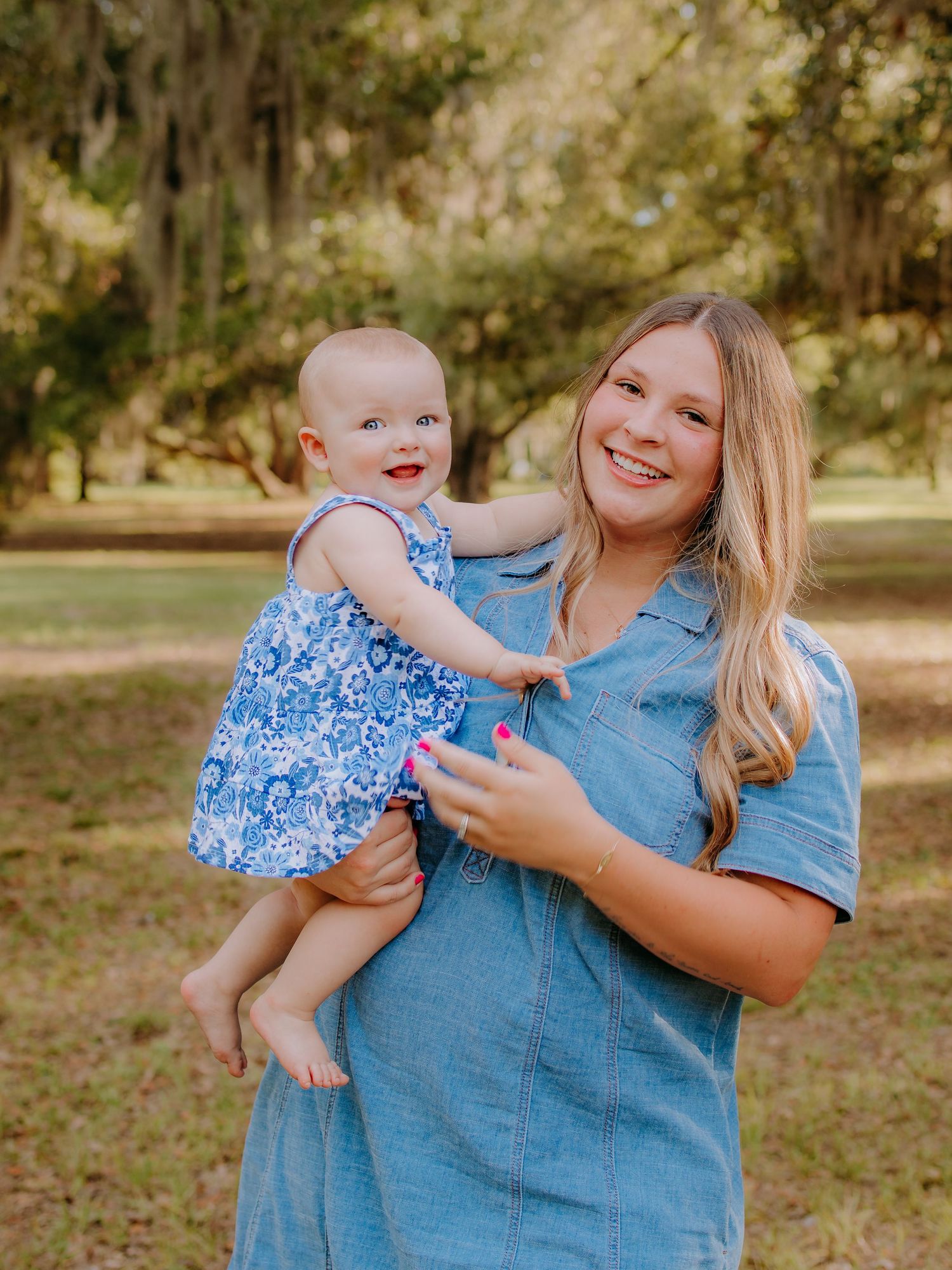 Mother and daughter smiling together during an outdoor photography session