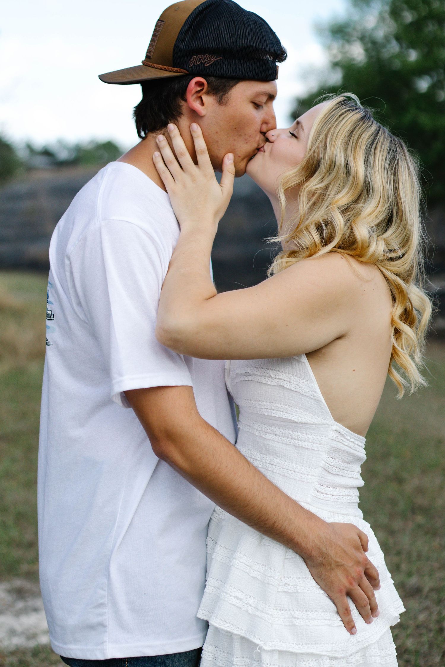 Couple kissing during a romantic outdoor photography session