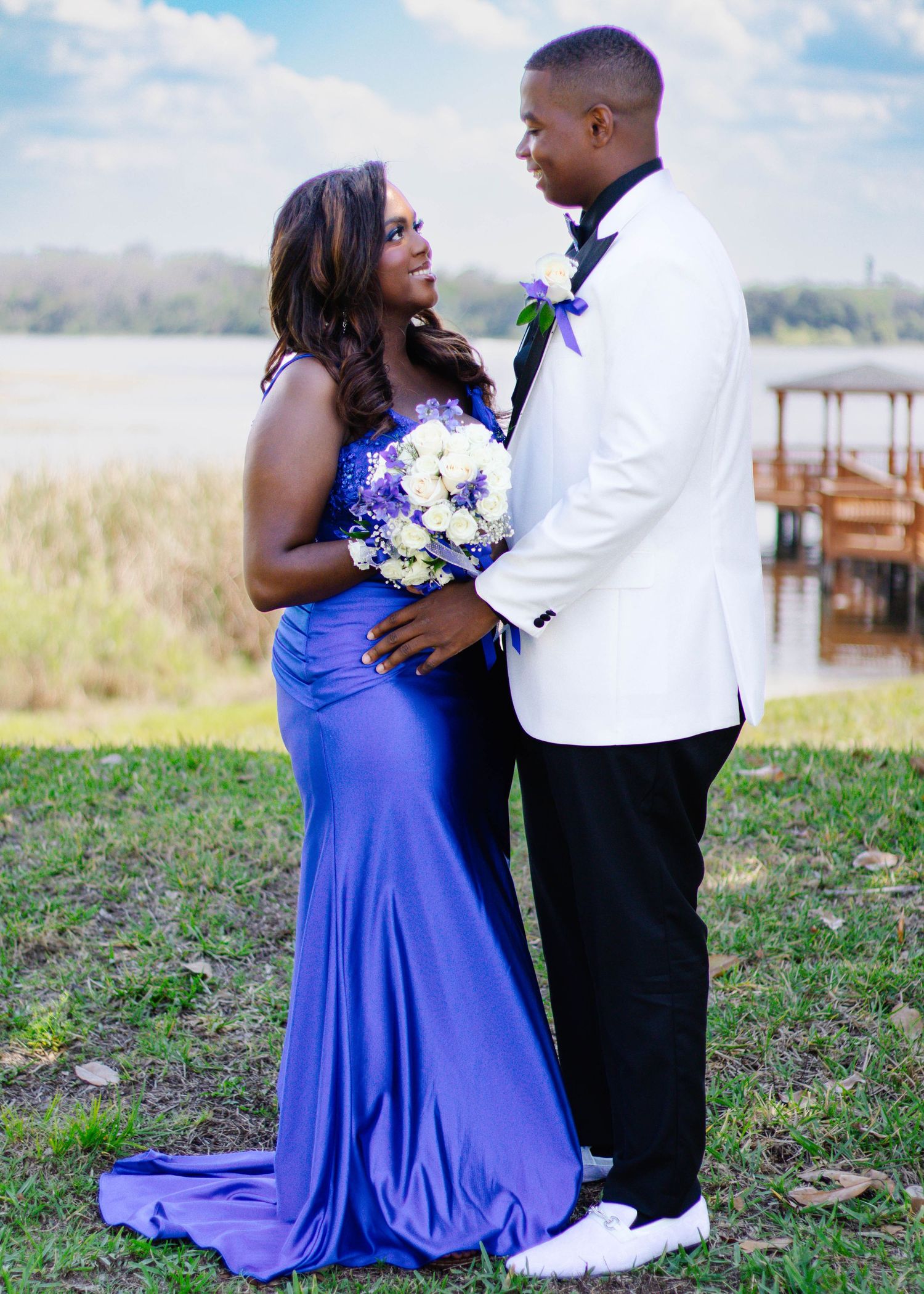 High school senior couple looking into each other’s eyes during a prom photography session