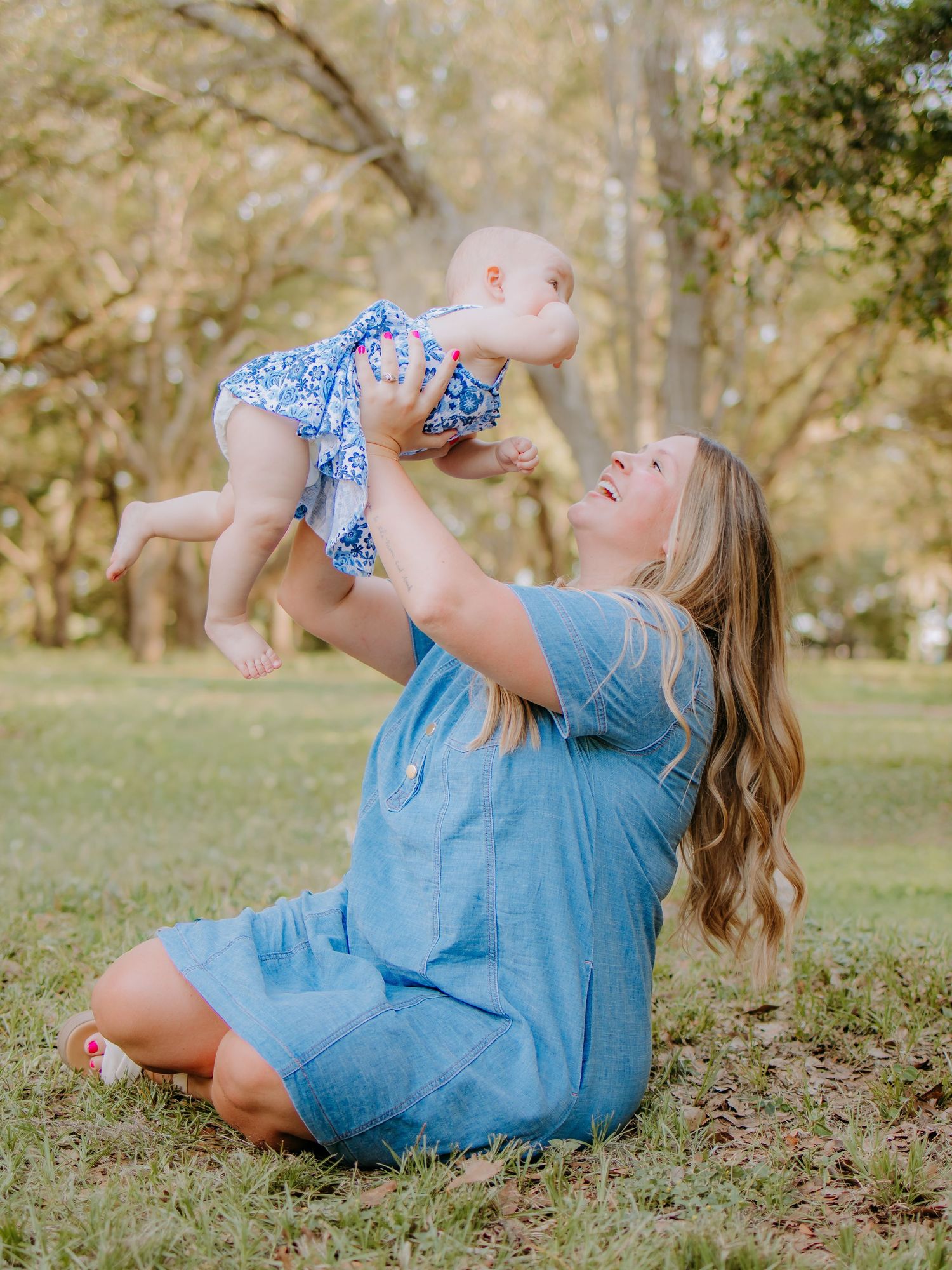 Mother and daughter sharing a candid moment outdoors during a photography session