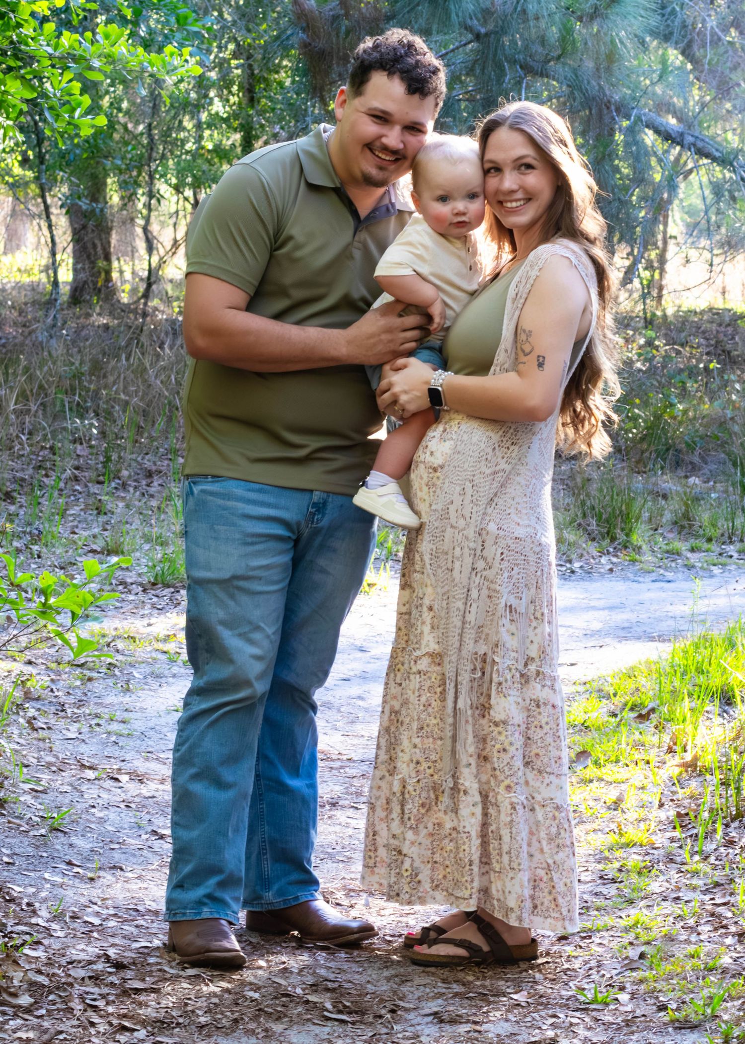 Family standing together outdoors during a natural photography session