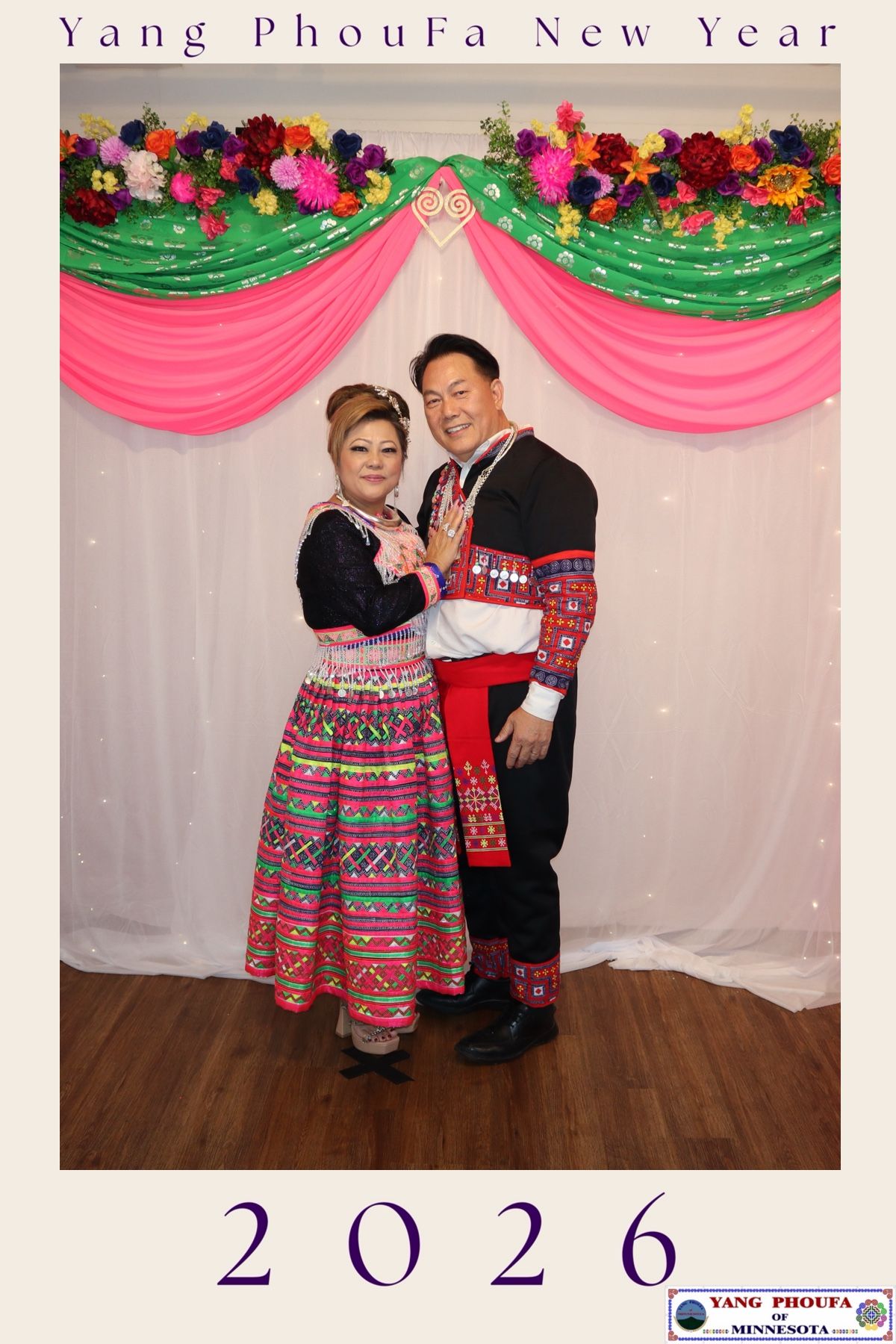Couple in traditional Hmong attire posing at Yang PhouFa New Year 2026 celebration in Minnesota.
