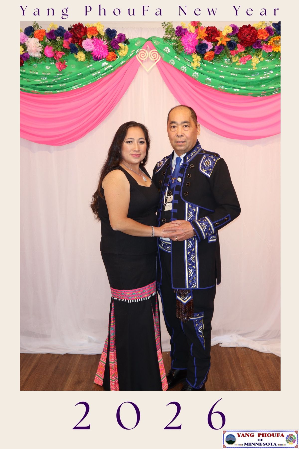 Couple dressed in elegant traditional Hmong attire poses at Yang PhouFa New Year 2026 event.