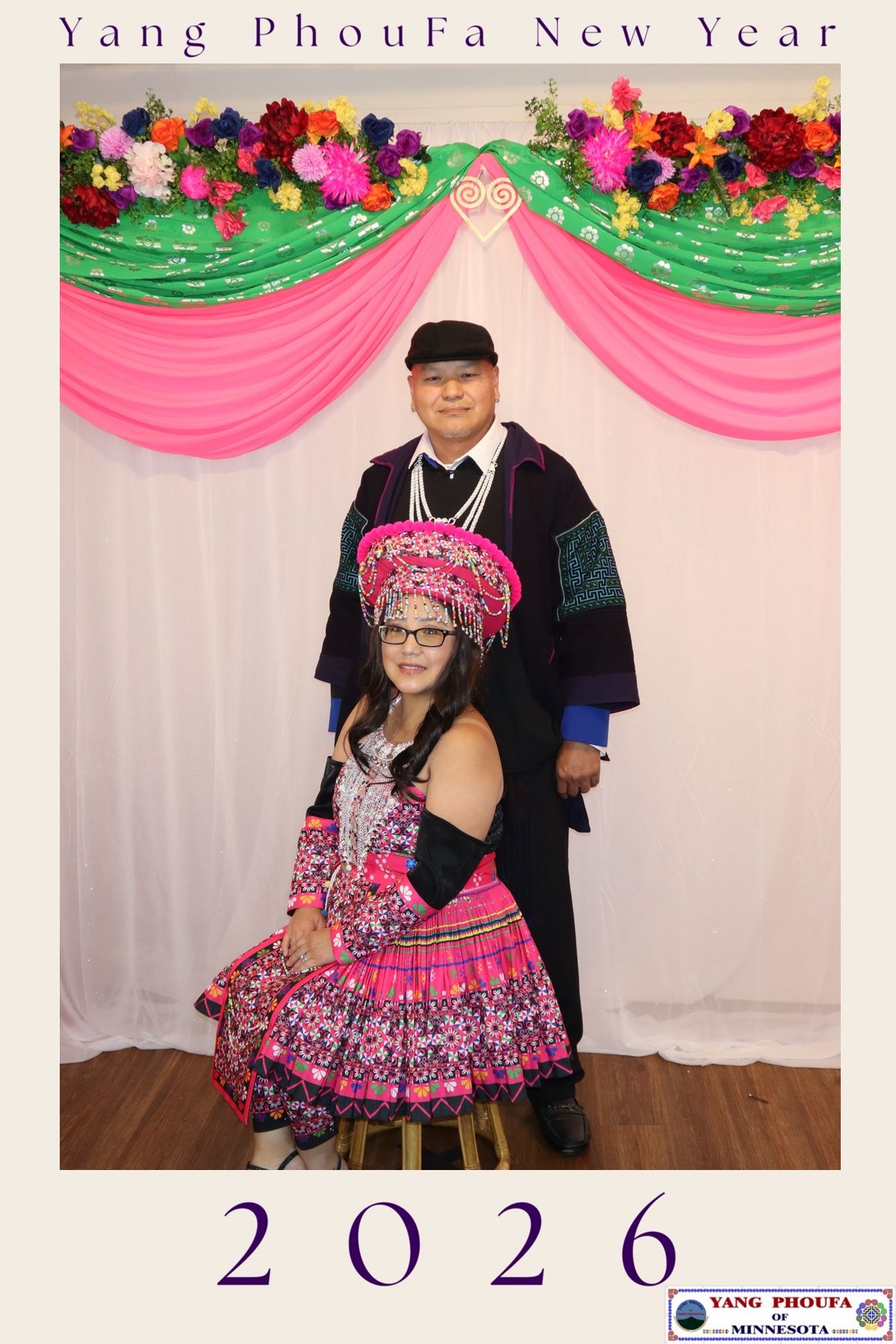 Couple in traditional Hmong attire poses at Yang PhouFa New Year 2026 celebration in Minnesota.