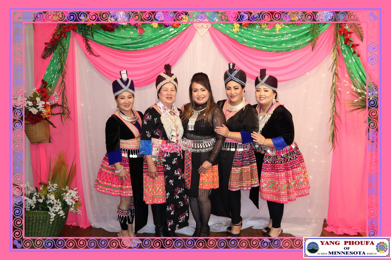 Five women pose in traditional Hmong clothing at Yang PhouFa Minnesota New Year celebration.
