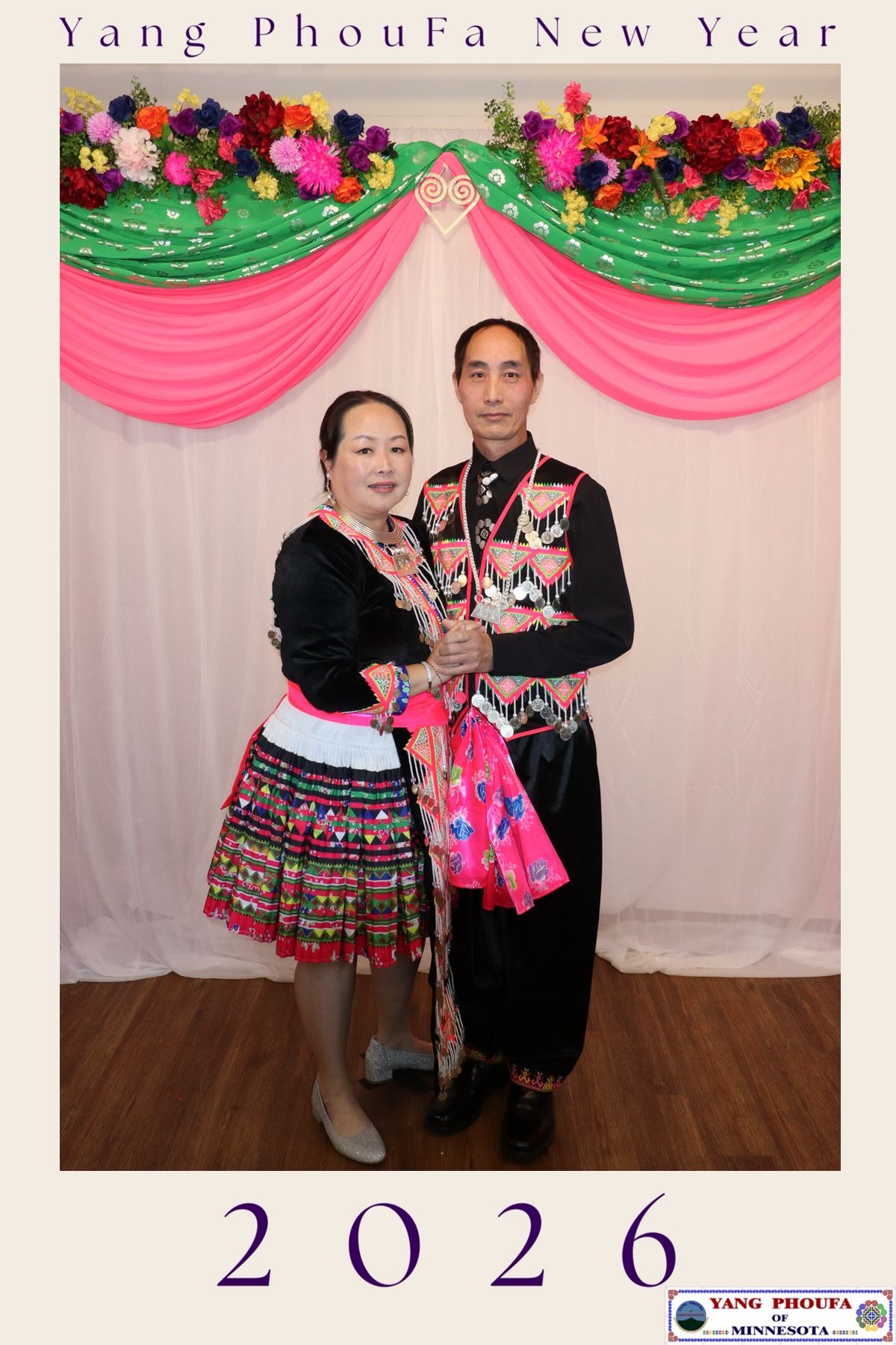 Couple in traditional Hmong attire posing at Yang PhouFa New Year 2026 celebration in Minnesota.