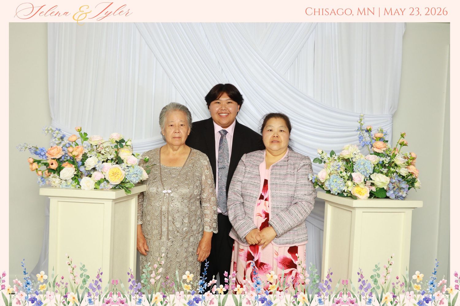 Man poses with two women at Selena and Tyler wedding in Chisago MN May 23 2026.