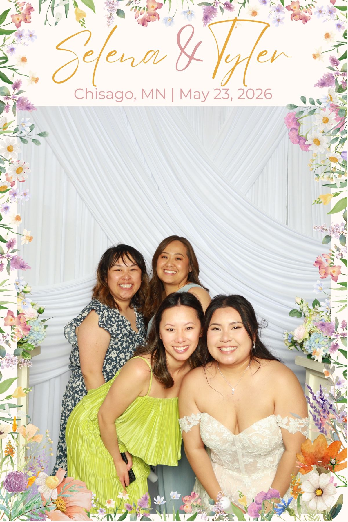 Four women pose at Selena and Tyler wedding photo booth in Chisago MN May 23 2026.