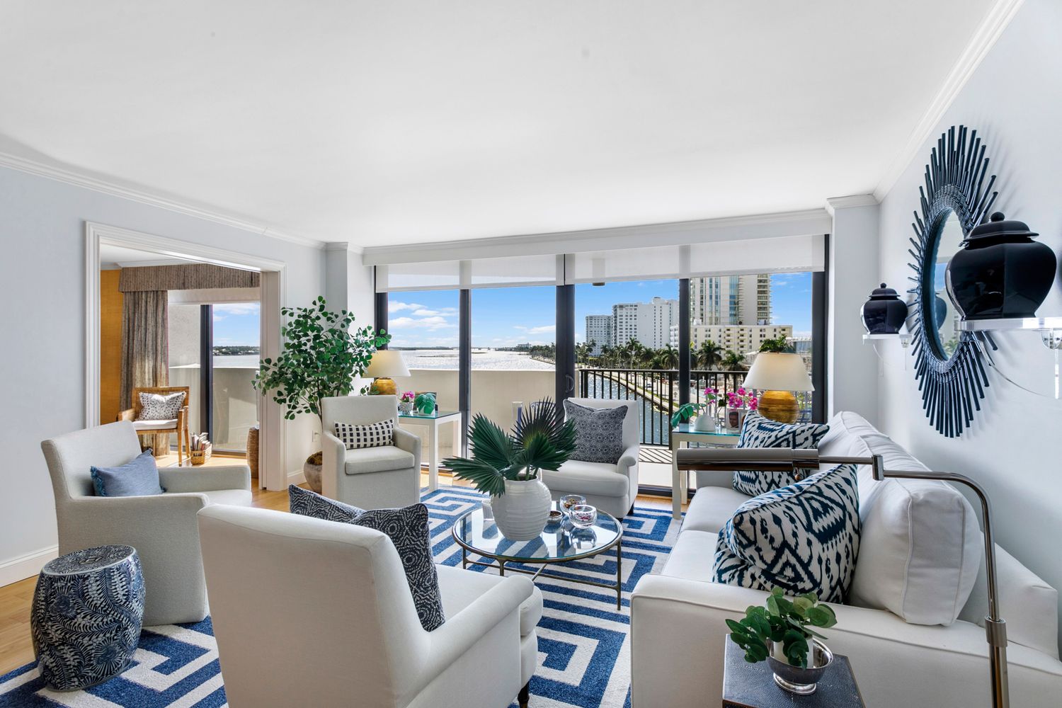 Bright condo living room with panoramic city views,  Professional real estate photography in Palm Beach, Florida by Brodiganphotography.com