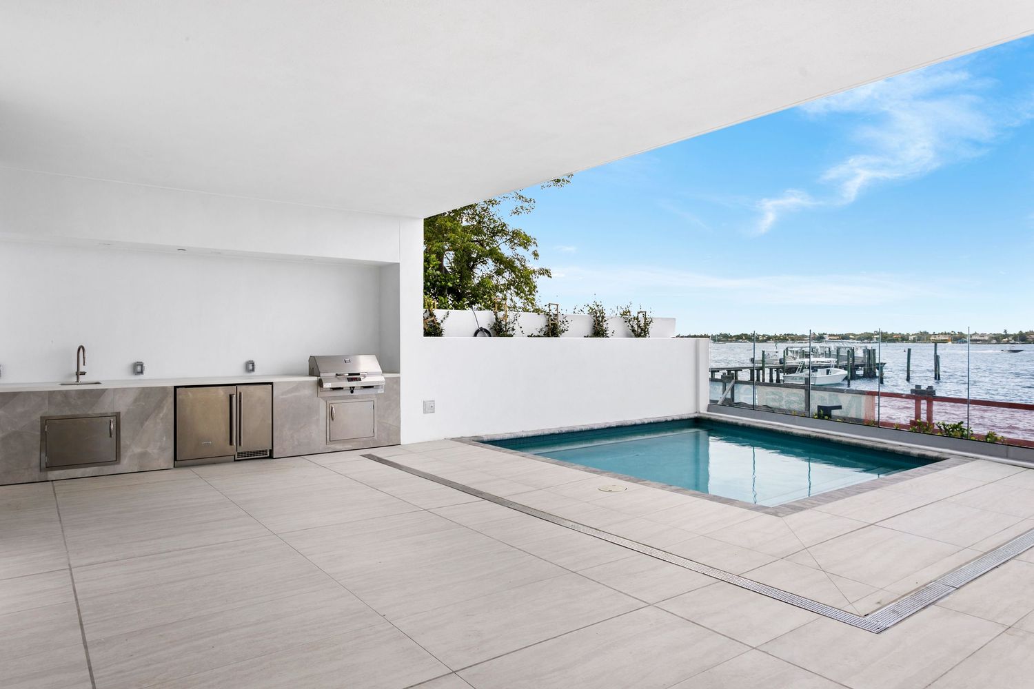 Luxury rooftop with private pool, outdoor kitchen, and waterfront views West Palm Beach upscale home residential brodiganphotograpy.com.