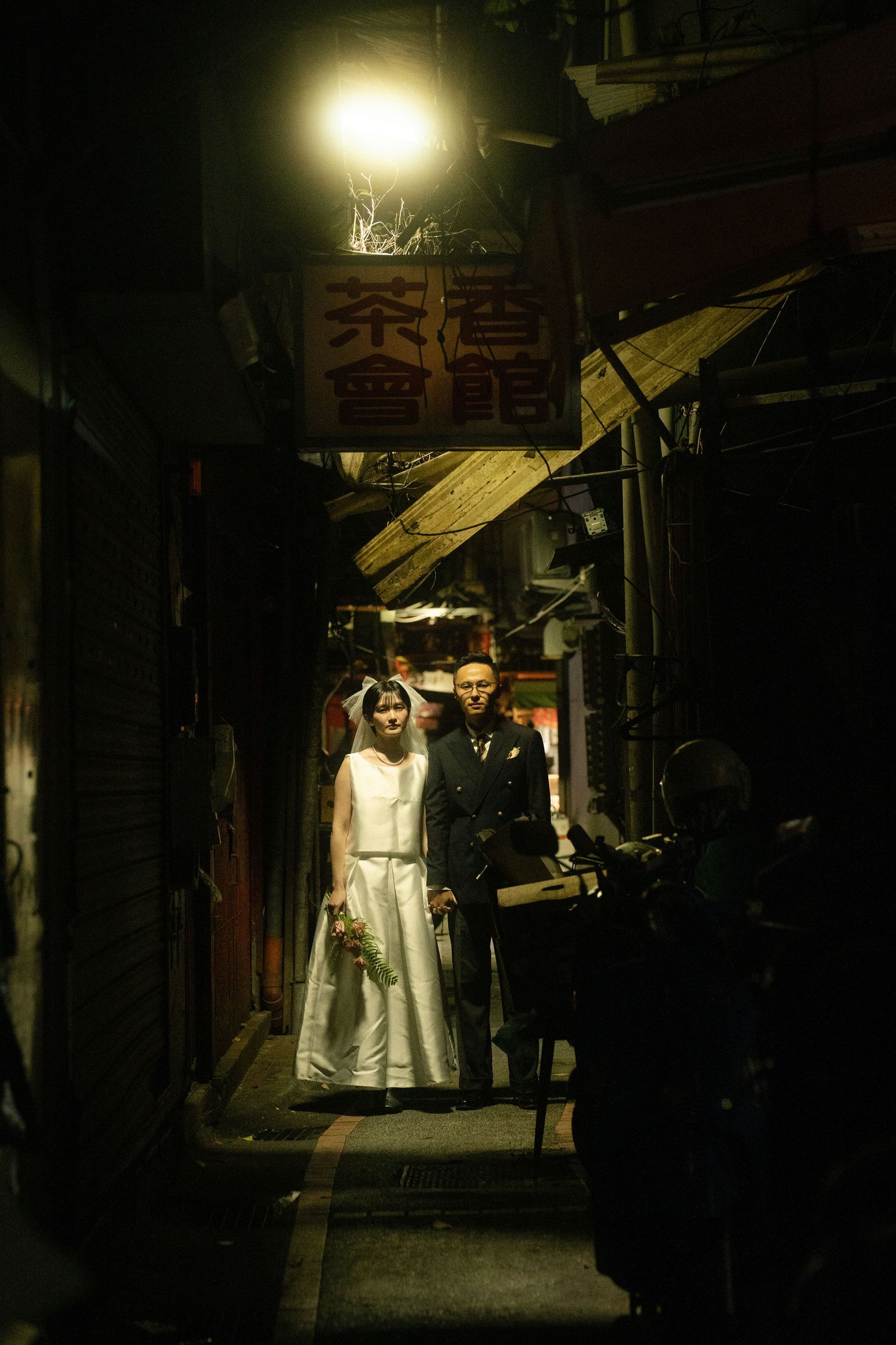 Moody Hong Kong Pre Wedding Photoshoot in Chinatown at night wearing wedding dress