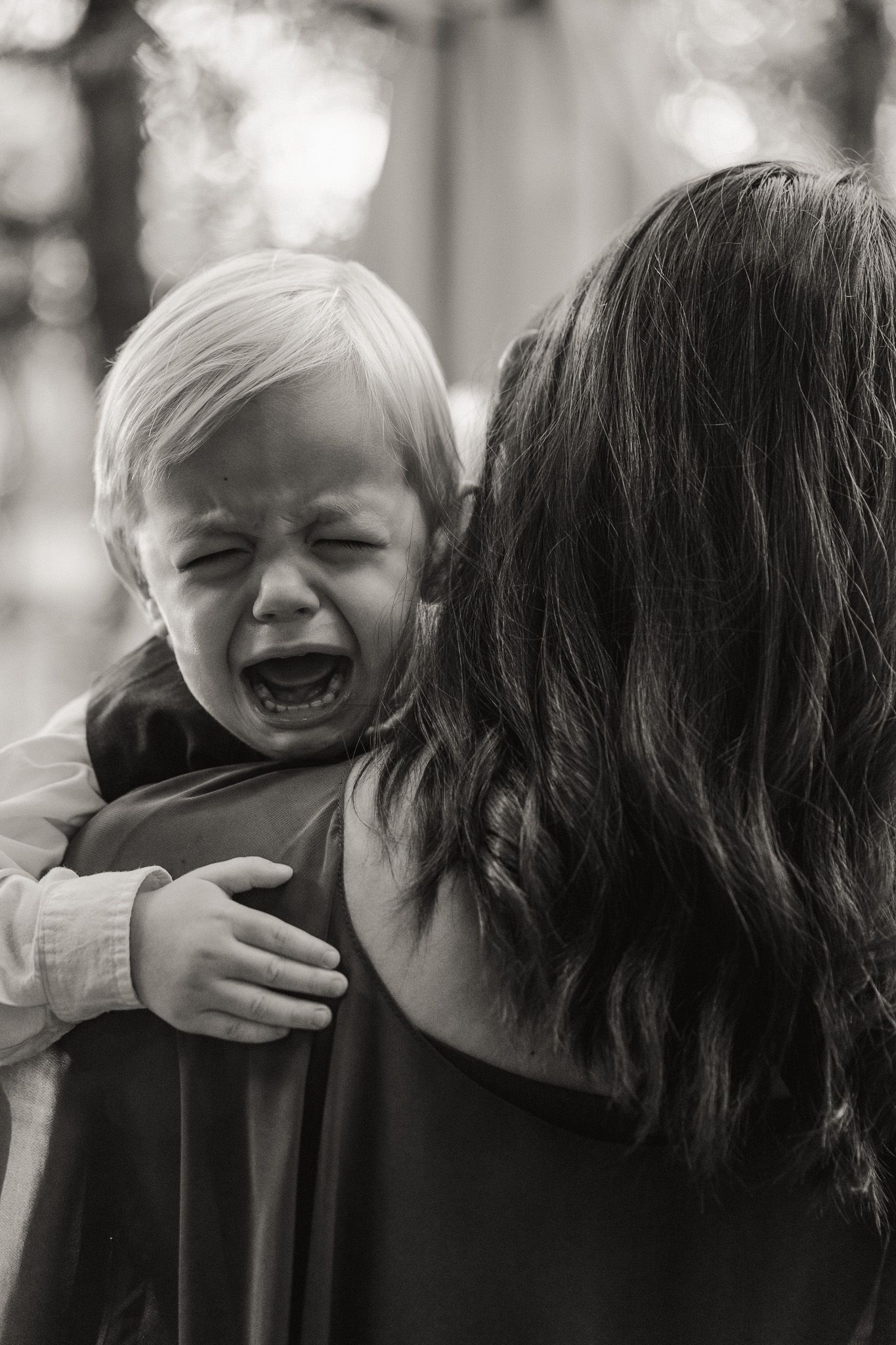 Emotional candid moment of a child at a Pasadena wedding captured by a Los Angeles wedding photographer