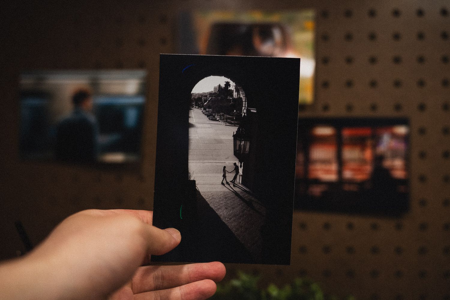 Editorial photo print of couple framed by archway architecture while holding hands at Pasadena City Hall