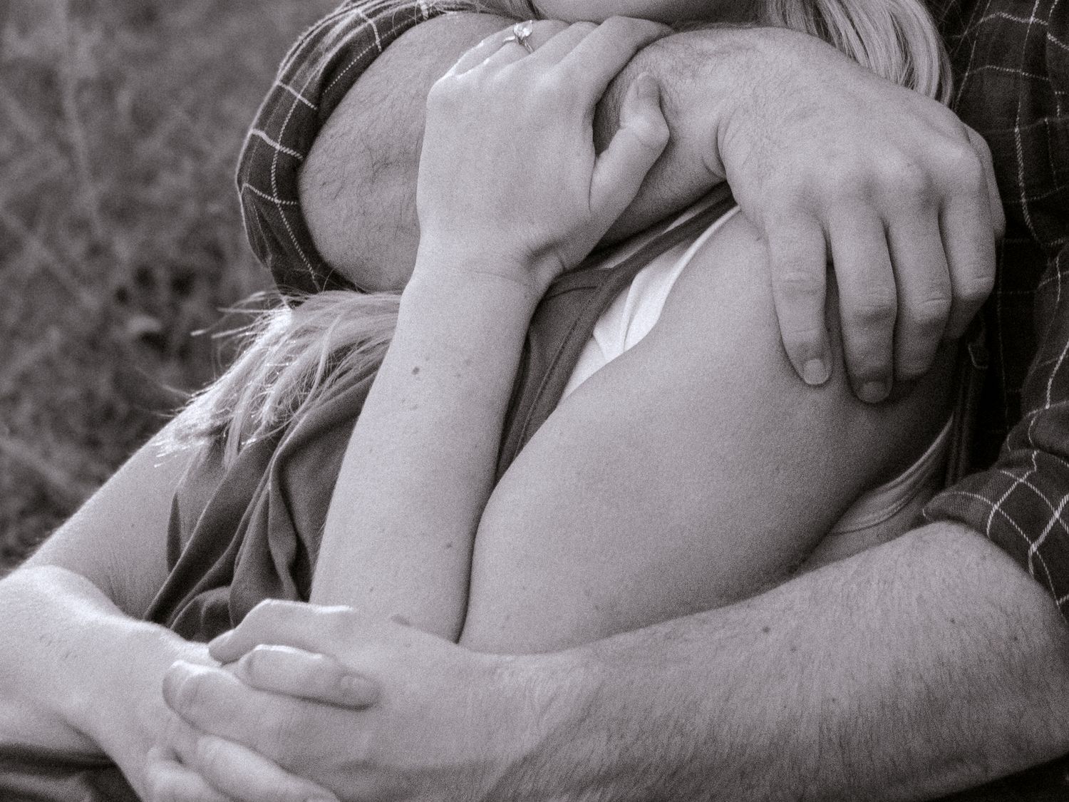 a couple in an embrace and cuddling together