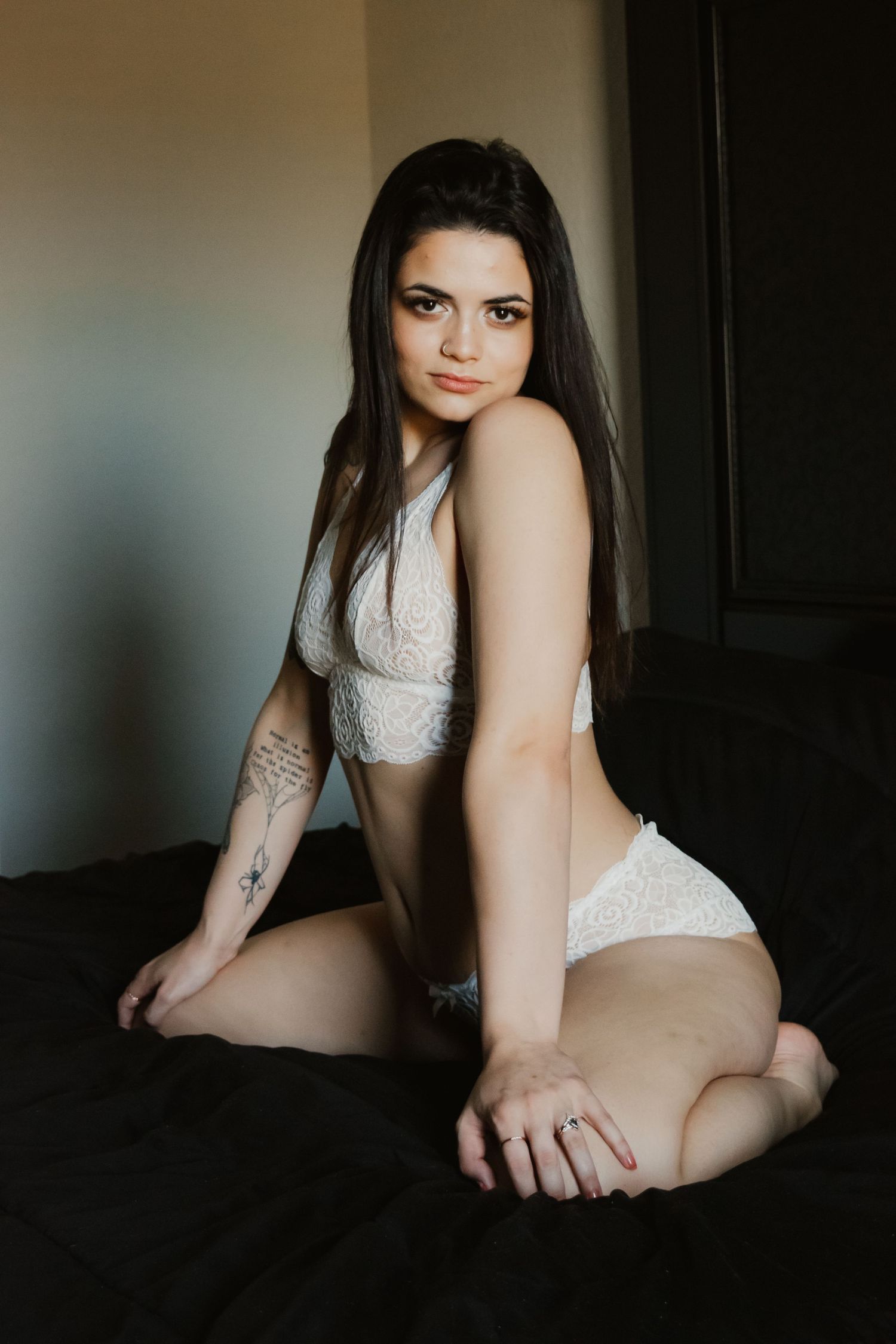 Artistic black and white boudoir photo series featuring intimate poses in moody lighting.